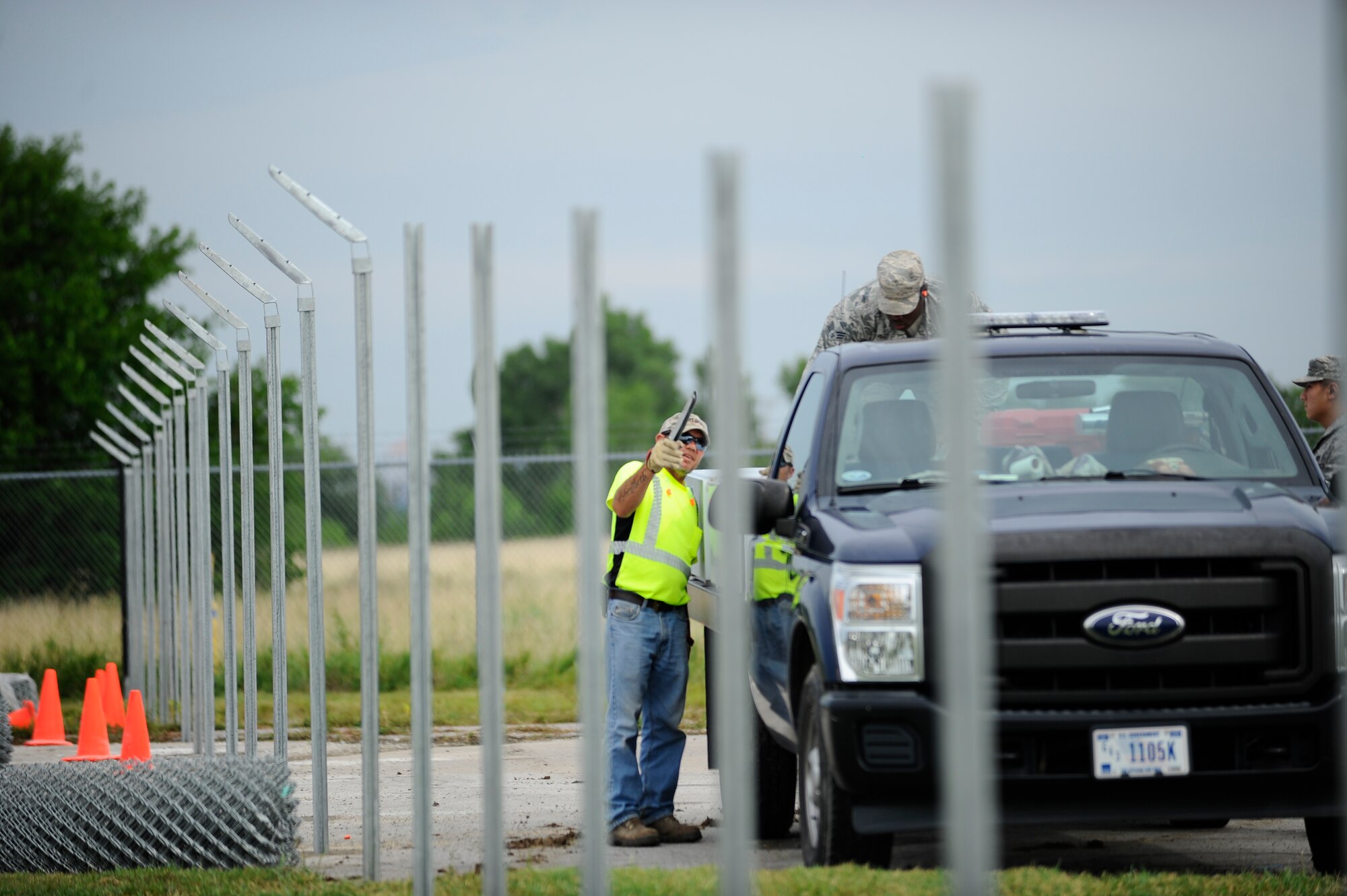 Bobby Wren, 22nd Civil Engineer Squadron horizontal pavements shop heavy equipment operator, counts the number fence posts his crew has to work on, July 22, 2015, at McConnell Air Force Base, Kan. The posts had to be cut to identical heights before having barbed wire and chain links attached to complete the project. (U.S. Air Force photo by Senior Airman Victor J. Caputo)