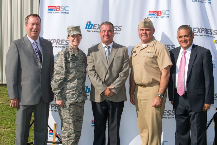 (From left to right) Todd Hobart, Maj. Rebecca Welton, Rich Weigold, Navy Capt. Timothy Sparks and Neils Merino-Thiebaud stand together July 22, 2015 at Joint Base Charleston during the Industries for the Blind Express Base Supply Center’s twentieth anniversary celebration. Sparks and Welton were both given commemorative coins for their support. Hobart, Weigold and Merino-Thiebaud are representatives for the IB Express. Welton is the 628th Contracting Squadron commander for Joint Base Charleston. Sparks is the Joint Base Charleston deputy commander. (U.S. Air Force photo/Airman 1st Class Thomas T. Charlton)