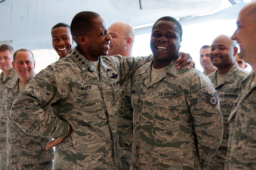 Gen. Darren W. McDew, Air Mobility Command commander, left, shares a humorous moment with Staff Sgt. Herbert Grant, fuel systems technician from the 108th Maintenance Group, at Joint Base McGuire Dix-Lakehurst, N.J., July 22, 2015. McDew visited the wing to meet with Air Mobility Airmen to discuss the current and future flying platforms of the Air National Guard. (U.S. Air National Guard photo by Airman 1st Class Julia Pyun/Released)