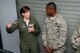 Master Sgt. Jennifer Bowen, boom operator from the 141st Air Refueling Squadron, Joint Base McGuire Dix-Lakehurst, N.J., explains to Gen. Darren W. McDew, Air Mobility Command commander, how the Boom Operator Simulator System works. McDew visited the wing July 22, 2015 to meet with Air Mobility Airmen to discuss the current and future flying platforms of the Air National Guard. (U.S. Air National Guard photo by Airman 1st Class Julia Pyun/Released)