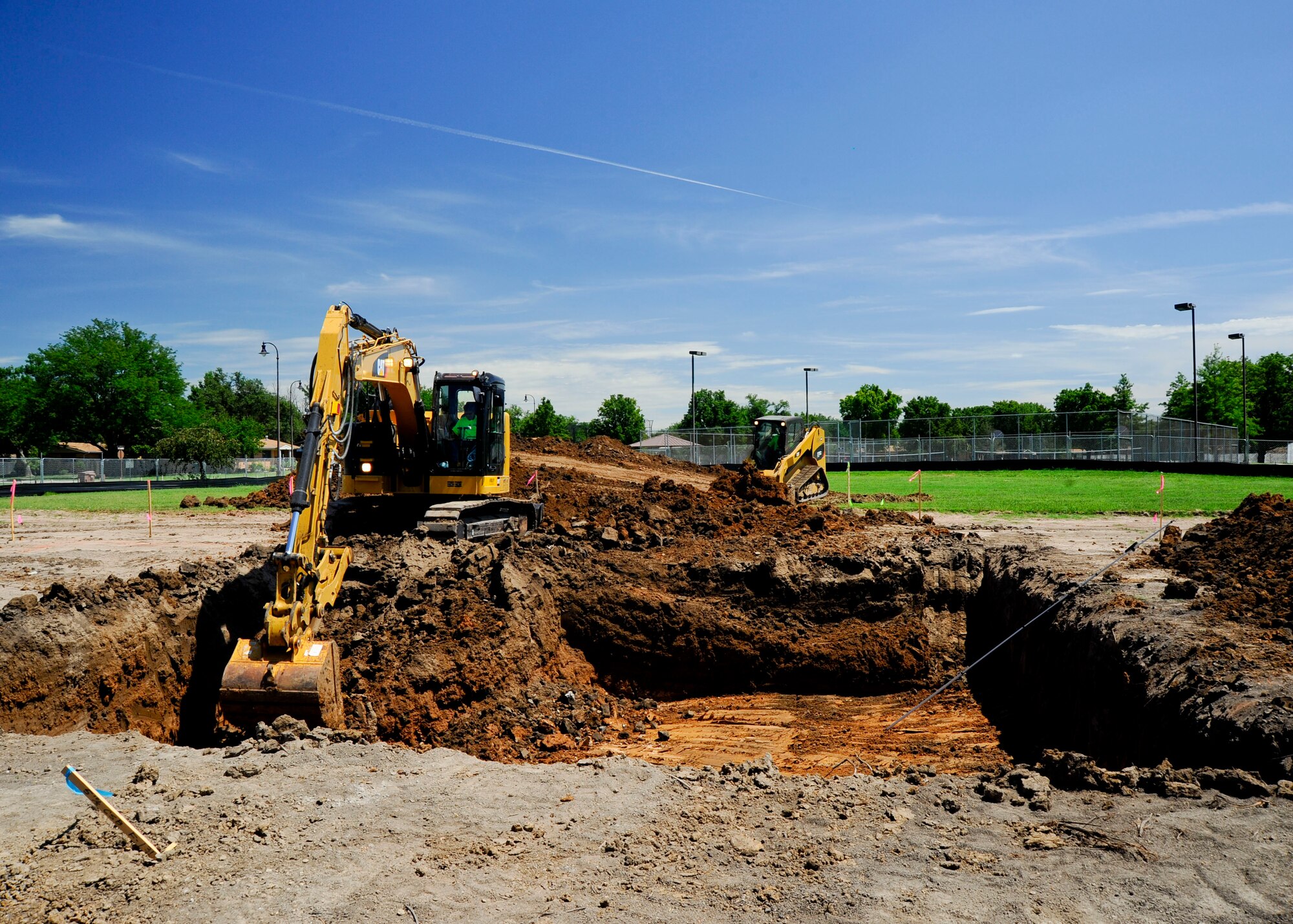 Construction begins on new homes in base housing, July 20, 2015, at McConnell Air Force Base, Kan. The project includes the construction of more than 150 new houses, a community center and the renovation of over 200 existing homes. The last home construction in base housing was accomplished in 1998. (U.S. Air Force photo by Senior Airman Victor J. Caputo)