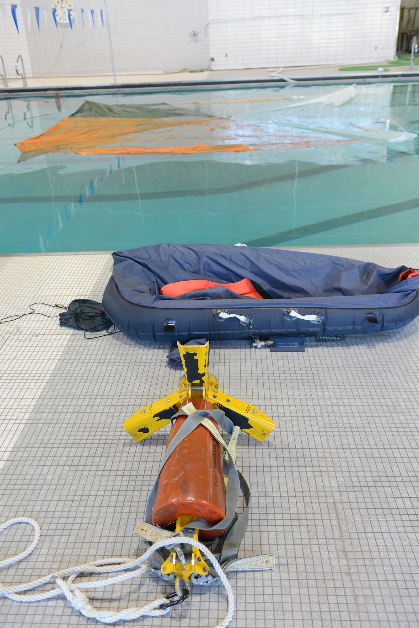 In the event of an emergency ejection over a large body of water, aviators will need to know how to properly use water survival equipment. Airmen from the 2nd Operations Support Squadron Survival, Evasion, Resistance and Escape teach aircrew members survival skills and how to use water survival equipment. (U.S. Air Force photo/Staff Sgt. Benjamin Gonsier)