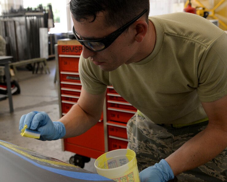Senior Airman Dylan Fox, 707th Maintenance Squadron aircraft structural maintenance journeyman, applies primer before adding a coat of paint on the cowling on Barksdale Air Force Base, La., July 20, 2015. Primer is used to prevent corrosion. (U.S. Air Force photo/Senior Airman Jannelle Dickey)