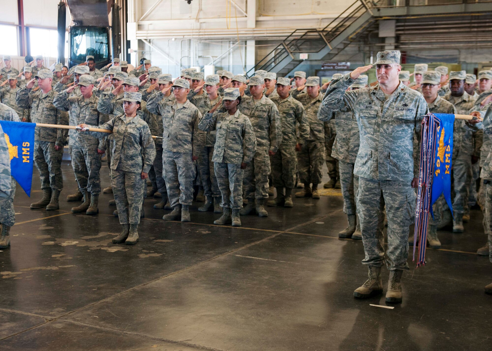 Airmen from the 49th Materiel Maintenance Group present arms as Col. Joseph Moehlmann, the incoming 49th Materiel Maintenance Group commander, prepares to accept the 49th MMG guidon at Holloman Air Force Base, N.M. on July 1. The 49th MMG is the Air Force’s only Basic Expeditionary Airfield Resources base, also known as BEAR base, which can supply responsive expeditionary airfield resources and expertise to support deployed military members as well as humanitarian efforts. (U.S. Air Force photo by 49th Wing Public Affairs Office)