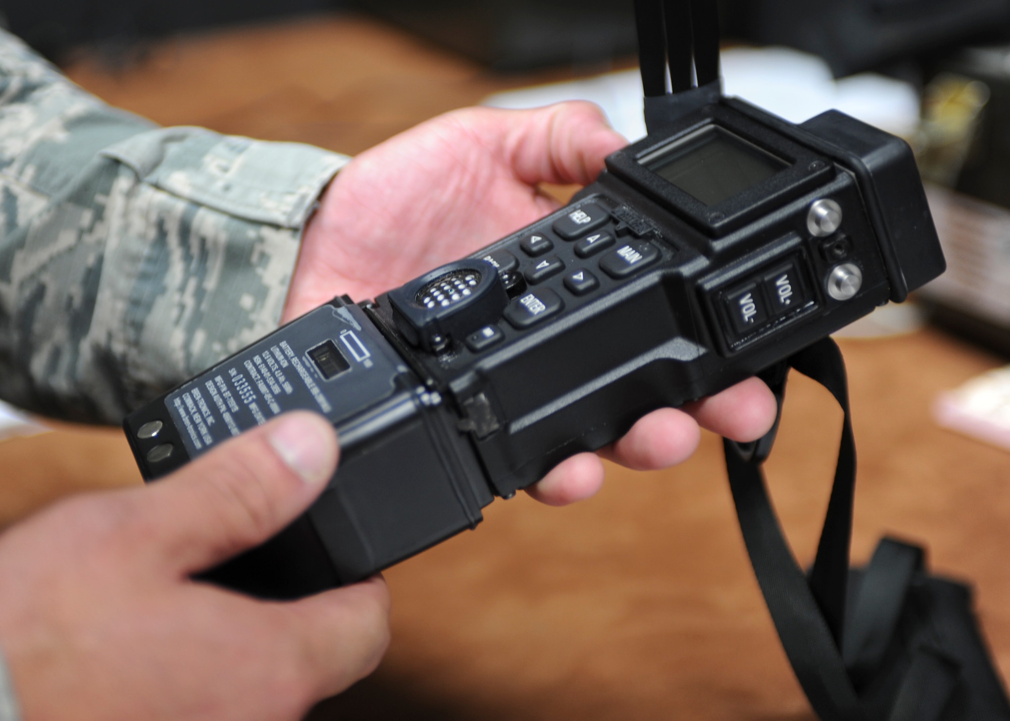 Staff Sgt. Justin McEldowney, 28th Operations Support Squadron aircrew flight equipment technician, performs an operations check on a Combat Survival Evader Locator radio at Ellsworth Air Force Base, S.D., June 25, 2015. The 28th Bomb Wing is the first B-1 unit in the Air Force to use this device, helping to enhance aircrew search and rescue capabilities. (U.S. Air Force photo by Senior Airman Anania Tekurio/Released)