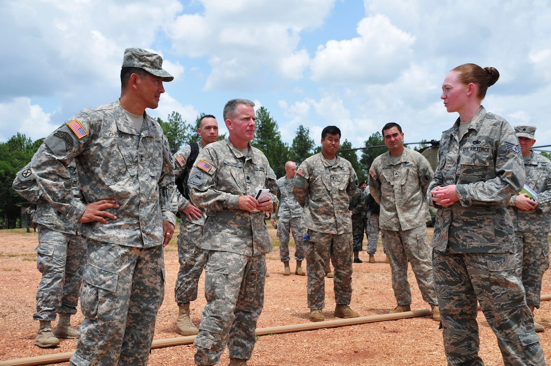 SOTO CANO AIR BASE, Honduras – Maj. Gen. K. K. Chinn, U.S. Army South commanding general (left), receives a briefing from U.S. Air Force Staff Sgt. Kimberly Grady, a non-commissioned officer with Joint Task Force-Bravo’s logistics directorate (right), during his visit to Mocoron, Honduras, July 18, 2015. Brady briefed the general on an ongoing project to increase the fuel-storage capacity at Mocoron, to expand JTF-Bravo’s ability to support Honduran Armed Forces as they counter transnational organized crime in the region of Gracias a Dios. (U.S. Air Force photo by Capt. Christopher Love)