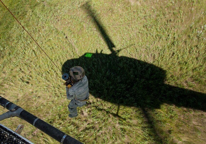 Staff Sgt. Clarence Rainey, 791st Missile Security Forces Squadron tactical response force member, is hoisted into a UH-N1 Helicopter near Garrison, N.D., July 20, 2015. Rainey and the helicopter’s crew were practicing search and rescue tactics for the upcoming Global Strike Challenge competition in Guernsey, Wyo. (U.S. Air Force photo/Senior Airman Stephanie Morris)