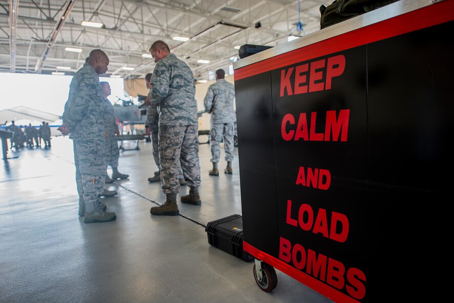 Members of the 75th Aircraft Maintenance Unit listen to the rules before the load crew of the quarter competition July 17, 2015, at Moody Air Force Base, Ga. The 75th AMU won for the second time this year. (U.S. Air Force photo by Airman 1st Class Ceaira Tinsley/Released)