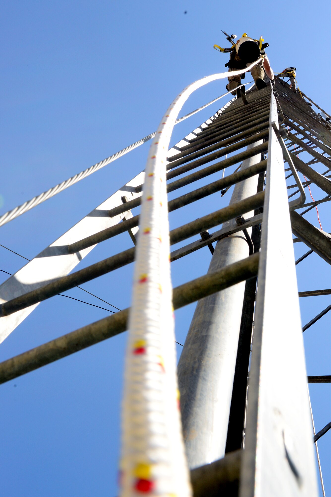 Airman 1st Class Robert Ritchie, 2nd Communication Squadron cable and antenna systems maintainer, climbs a communication tower on Barksdale Air Force Base, La., July 15, 2015. Antennae on communication towers must be operable for communication between base personnel as well as pilots. (U.S. Air Force Photo/Airman 1st Class Luke Hill)