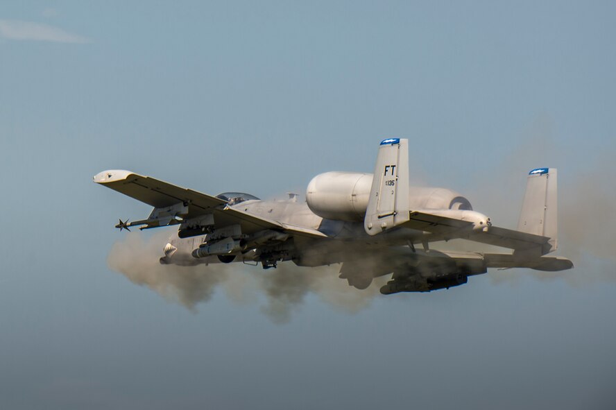 An A-10C Thunderbolt II from the 74th Fighter Squadron performs a strafing run during a combat search and rescue demonstration July 15, 2015, at Moody Air Force Base, Ga. During the demonstration, U.S. Air Force Gen. Hawk Carlisle, commander Air Combat Command, saw Airmen from the 23d Fighter Group and the 347th Rescue Group demonstrate their capabilities in the air and on the ground. (U.S. Air Force photo by Senior Airman Ryan Callaghan/Released)