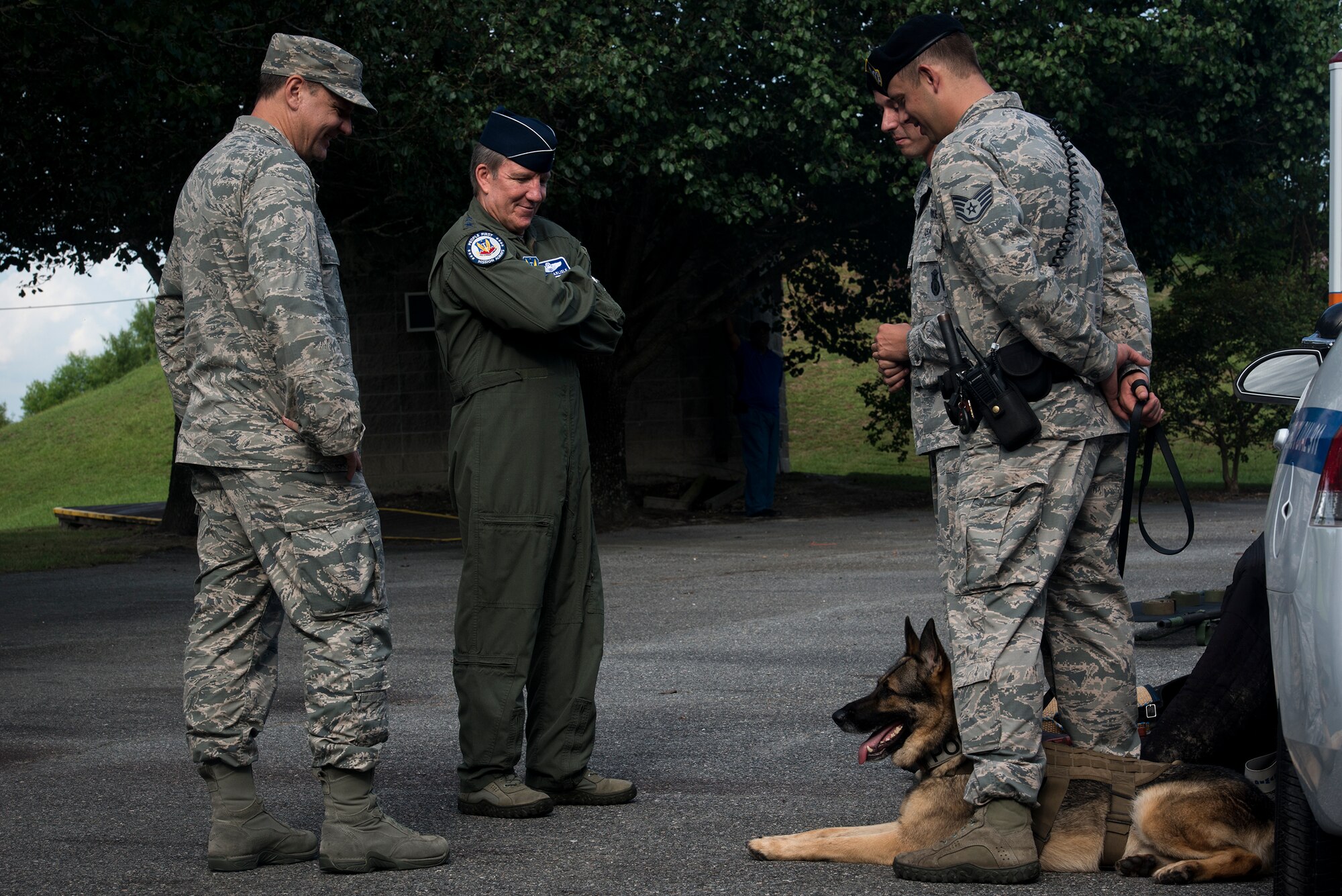 U.S. Air Force Gen. Hawk Carlisle, center, commander Air Combat Command, speaks with military working dog handlers from the 23d Security Forces Squadron July 15, 2015, at Moody Air Force Base, Ga. Carlisle also spoke with Airmen from the 23d Medical Group and explosive ordnance disposal specialists from the 23d Civil Engineer Squadron during his visit. (U.S. Air Force photo by Senior Airman Ryan Callaghan/Released)