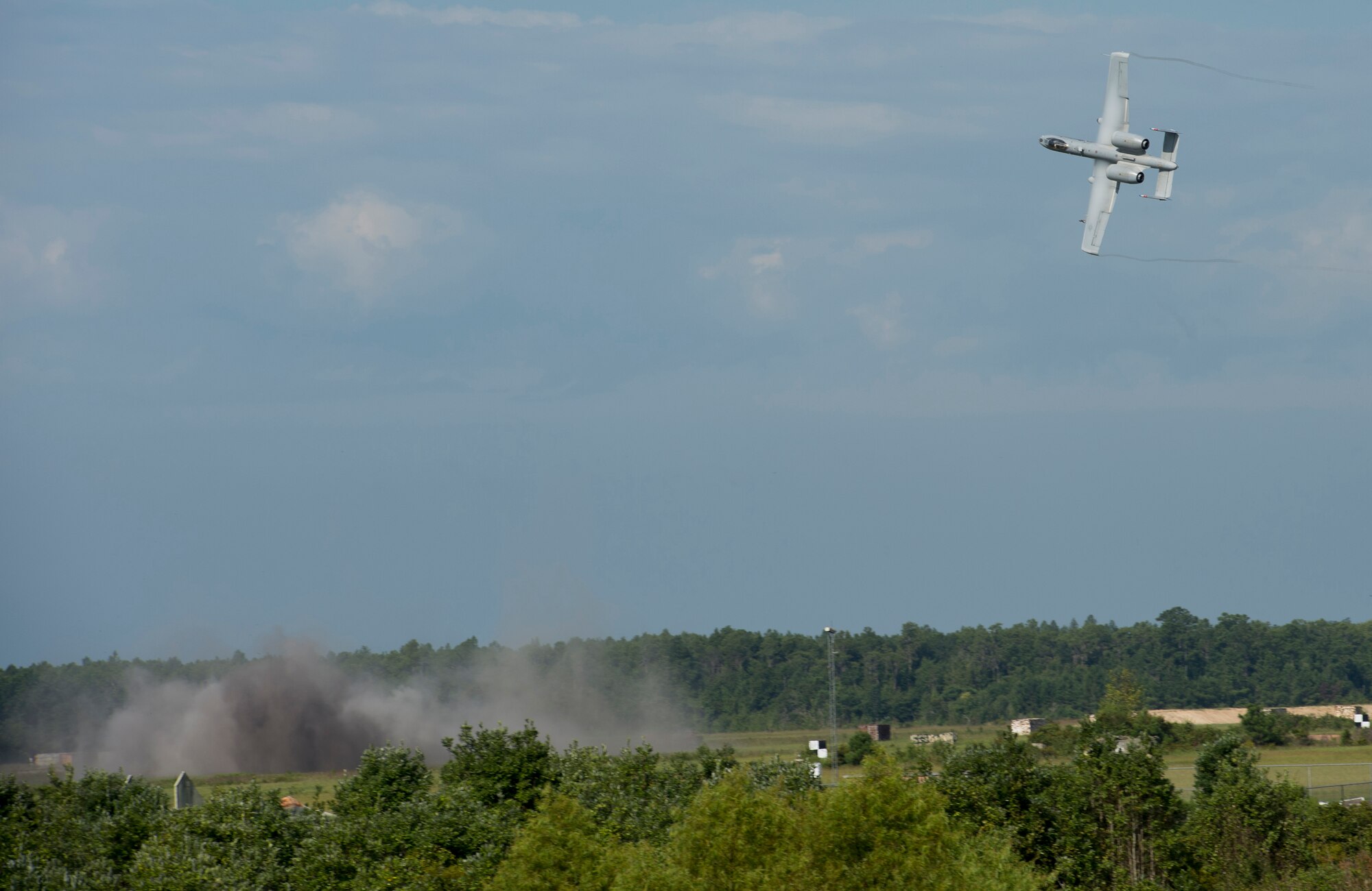 An A-10C Thunderbolt II turns after performing a strafe run during a combat search and rescue demonstration July 15, 2015, at Moody Air Force Base, Ga. U.S. Air Force Gen. Hawk Carlisle’s, commander Air Combat Command, observed how A-10s carry out close-air-support missions while visiting Airmen. (U.S. Air Force photo by Staff Sgt. Eric Summers Jr./Released)