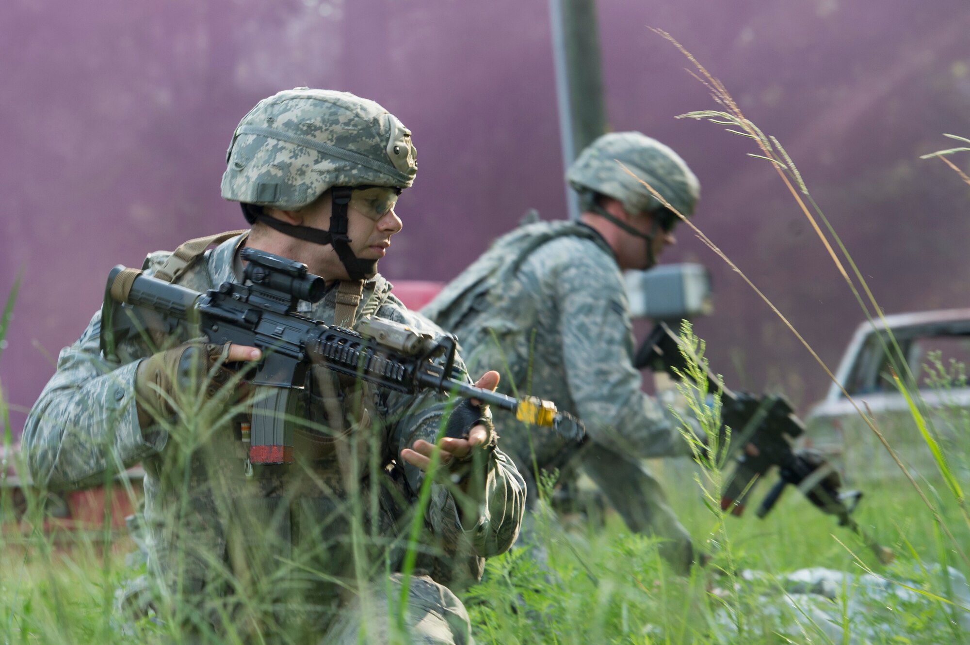 Members of the 820th Base Defense Group maintain security during a demonstration of defense tactics July 15, 2015, at Moody Air Force Base, Ga. The demonstration showed the ability of 820th BDG Airmen to secure and maintain an area in a hostile environment. (U.S. Air Force photo by Staff Sgt. Eric Summers Jr./Released)