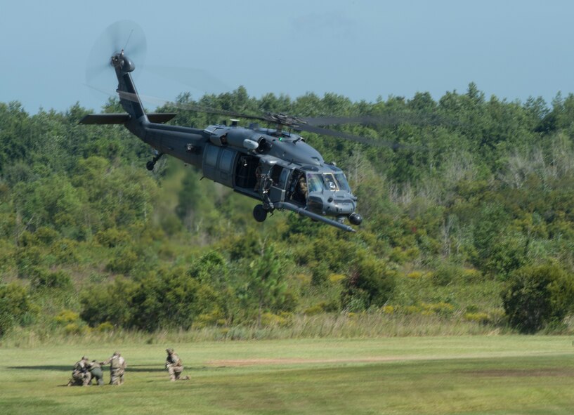 An HH-60G Pavehawk returns to the air after dropping off 38th Rescue Squadron pararescuemen during a combat search and rescue demonstration July 15, 2015, at Moody Air Force Base, Ga. The Pavehawk plays a vital role in the mission of the 23d Wing by conducting day or night personnel recovery operations into hostile environments to recover isolated personnel. (U.S. Air Force photo by Staff Sgt. Eric Summers Jr./Released)