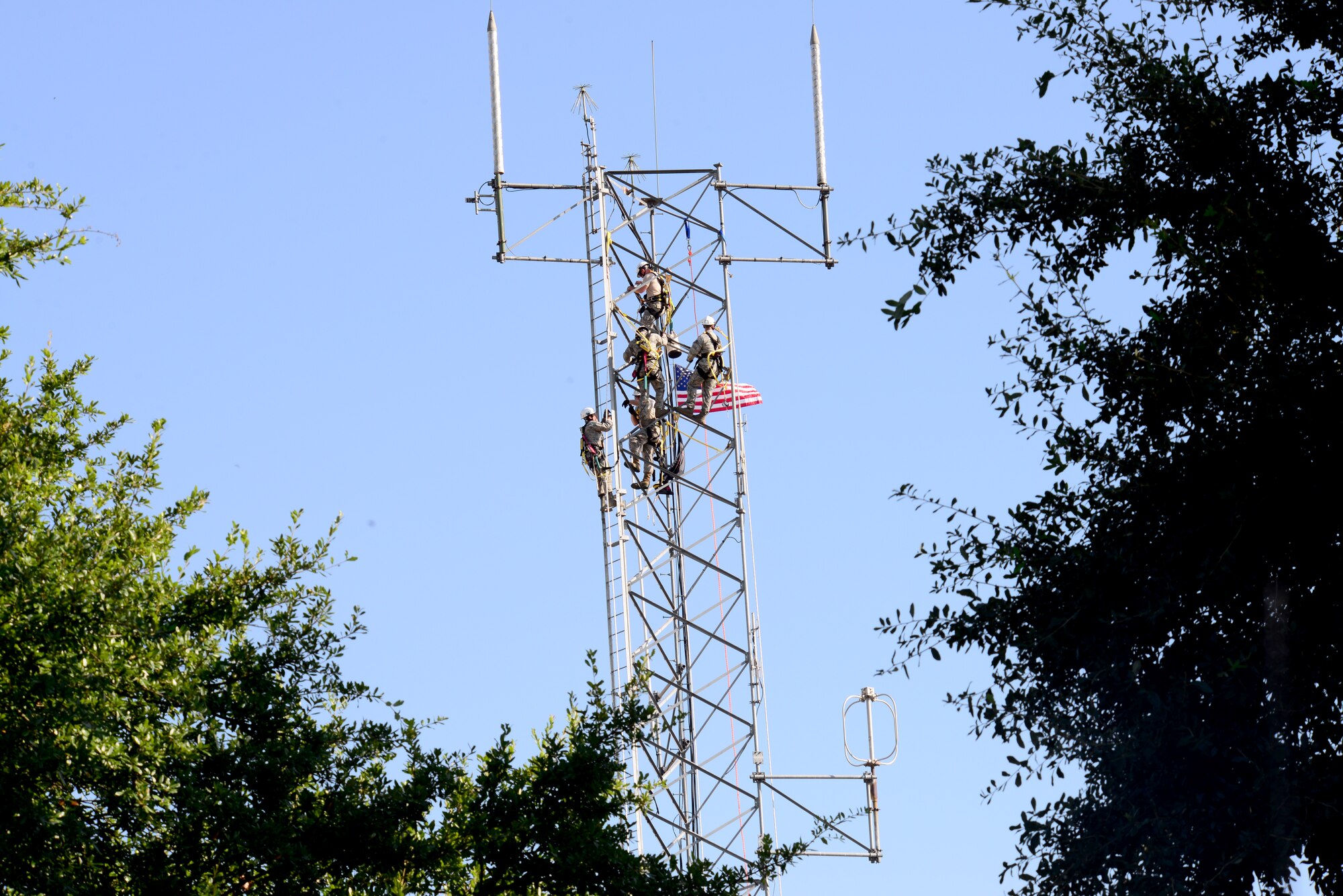 2nd Communication Squadron cable and antenna systems maintainers, scale a communication tower on Barksdale Air Force Base, La., July 15, 2015. Training focused on climbing, safety, and rescuing a disabled climber. (U.S. Air Force Photo/Airman 1st Class Luke Hill)