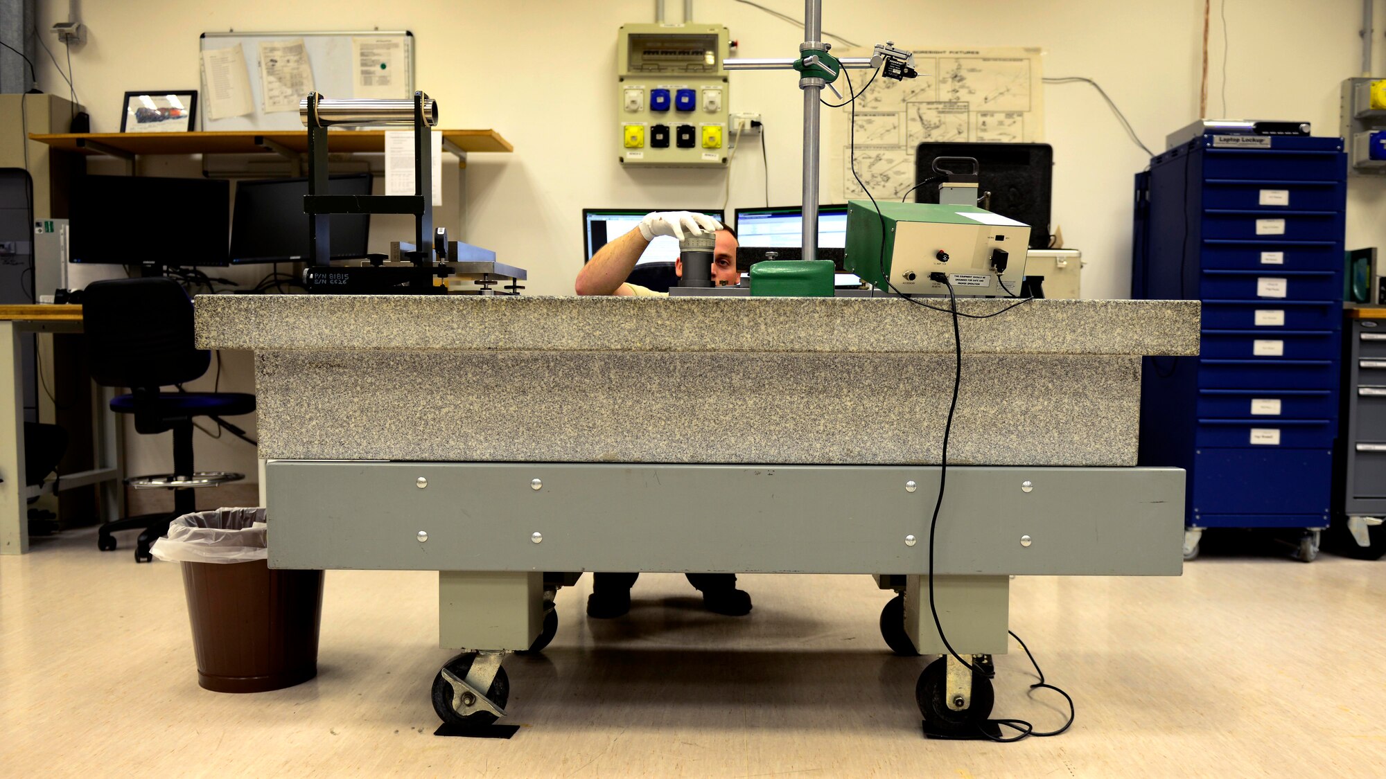 U.S. Air Force Staff Sgt. Timothy Gensure, 31st Maintenance Squadron precision measurement equipment laboratory test management diagnostic equipment supervisor, calibrates an electronic leveling head, July 20, 2015, at Aviano Air Base, Italy. The shop technicians calibrate weapons systems test equipment in support of tactical air navigation and instrument landing systems. (U.S. Air Force photo by Senior Airman Areca T. Wilson/Released)