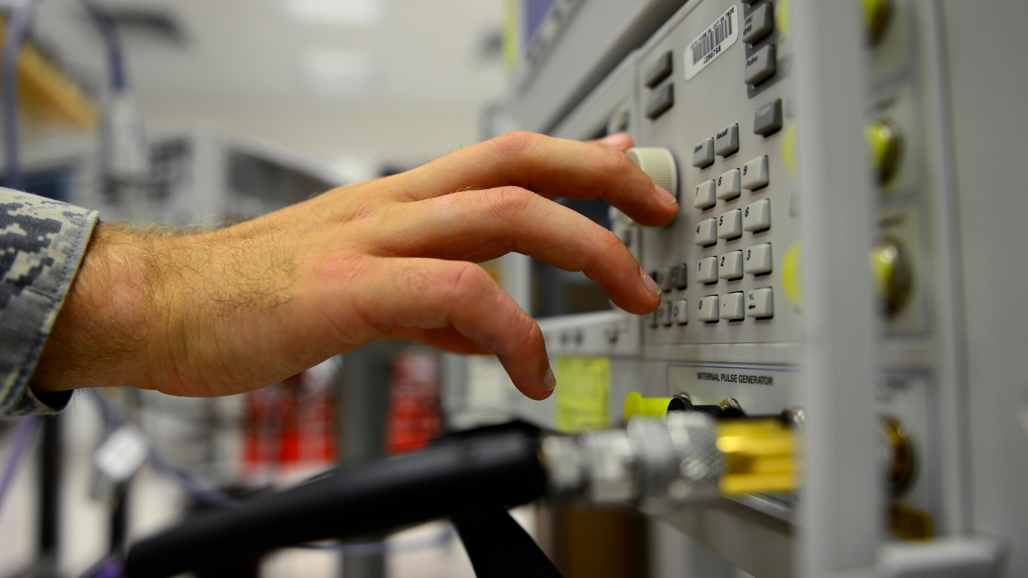U.S. Air Force Senior Airman Christopher Wahrmund, 31st Maintenance Squadron precision measurement equipment laboratory test management diagnostic equipment technician, calibrates a spectrum analyzer, July 20, 2015, at Aviano Air Base, Italy. The shop technicians calibrate weapons systems test equipment that support tactical air navigation, instrument landing systems and laser-guided munition/infrared missile testers. (U.S. Air Force photo by Senior Airman Areca T. Wilson/Released)