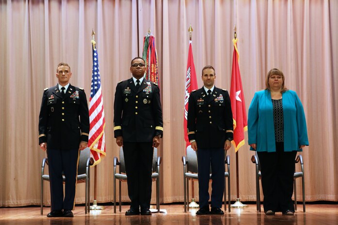 Lt. Col. Matthew Luzzatto (left) assumed command of the U.S. Army Corps of Engineers, Charleston District from Lt. Col. John Litz (second from the right) during a change of command ceremony July 10, 2015 in Charleston, S.C. Brig. Gen. C. David Turner (second from left) commander of the South Atlantic Division presided over the ceremony. Liza Metheney (right), is the USACE, Charleston District deputy district engineer. Luzzatto joins the Charleston District as the 86th Commander and District Engineer from his latest assignment as the Chief of Host Nation Construction for U.S. Forces Japan in Tokyo. As district engineer, Luzzatto will be responsible for planning, engineering and constructing water resource projects, such as the Charleston Harbor Post 45 Deepening Project, and administering laws for the protection of navigable waterways and regulatory actions for the state. He will oversee approximately 250 employees who are stationed throughout the state. Luzzatto will oversee the military construction program at Fort Jackson, as well as other federal agencies, such as Joint Base Charleston, throughout the city, state, and region. (Courtesy photo / U.S. Army Corps of Engineers, Charleston District)