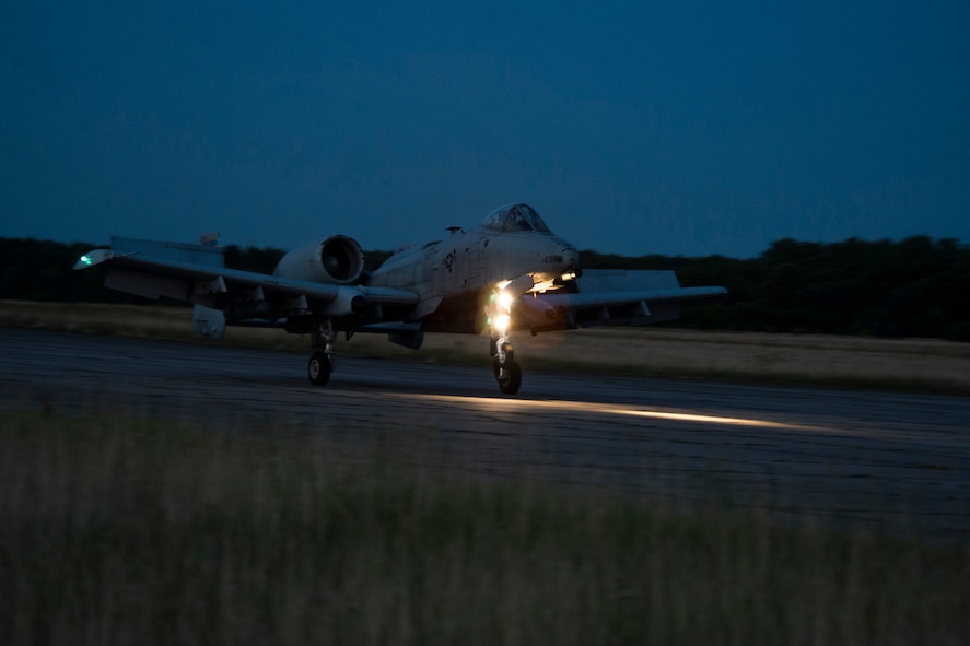 A 354th Expeditionary Fighter Squadron A-10C Thunderbolt II aircraft takes off during an austere landing training exercise at Nowe Miasto, Poland, July 20, 2015. The group of A-10 pilots performed unimproved surface landings during the night and had no lighting on the runway. (U.S. Air Force photo by Airman 1st Class Luke Kitterman/Released)