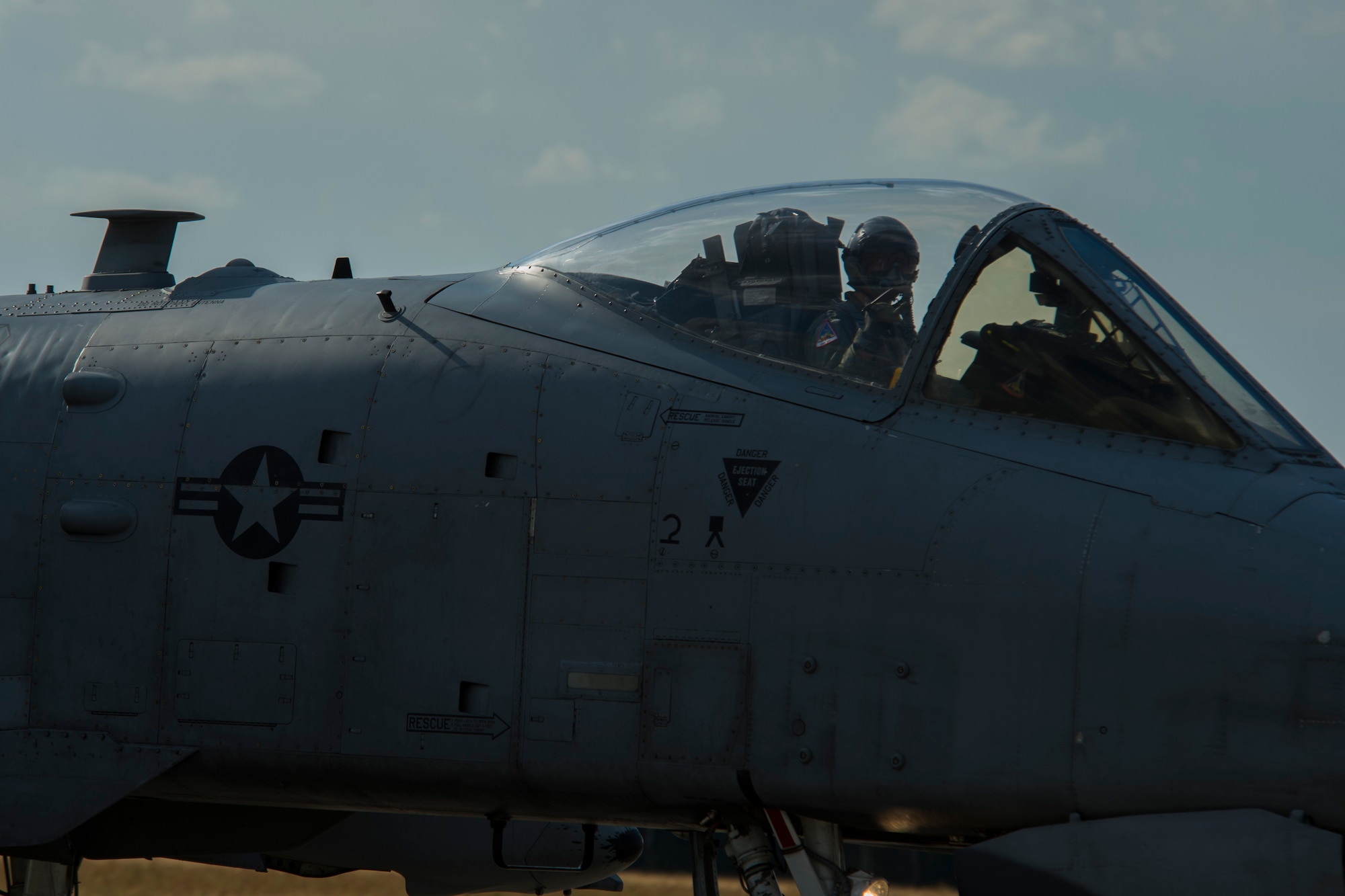 A 354th Expeditionary Fighter Squadron A-10C Thunderbolt II aircraft pilot travels down the runway during an austere landing training exercise at Nowe Miasto, Poland, July 20, 2015. The deployed A-10s are part of the first European Theater Security Package. (U.S. Air Force photo by Airman 1st Class Luke Kitterman/Released)