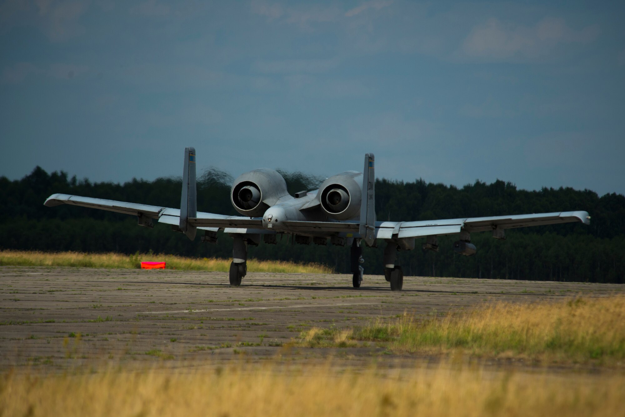 A 354th Expeditionary Fighter Squadron A-10C Thunderbolt II aircraft travels down a runway during an austere landing training exercise at Nowe Miasto, Poland, July 20, 2015. The rugged surface conditions of the runway allow pilots to closely simulate landing conditions in a deployed environment. (U.S. Air Force photo by Airman 1st Class Luke Kitterman/Released)