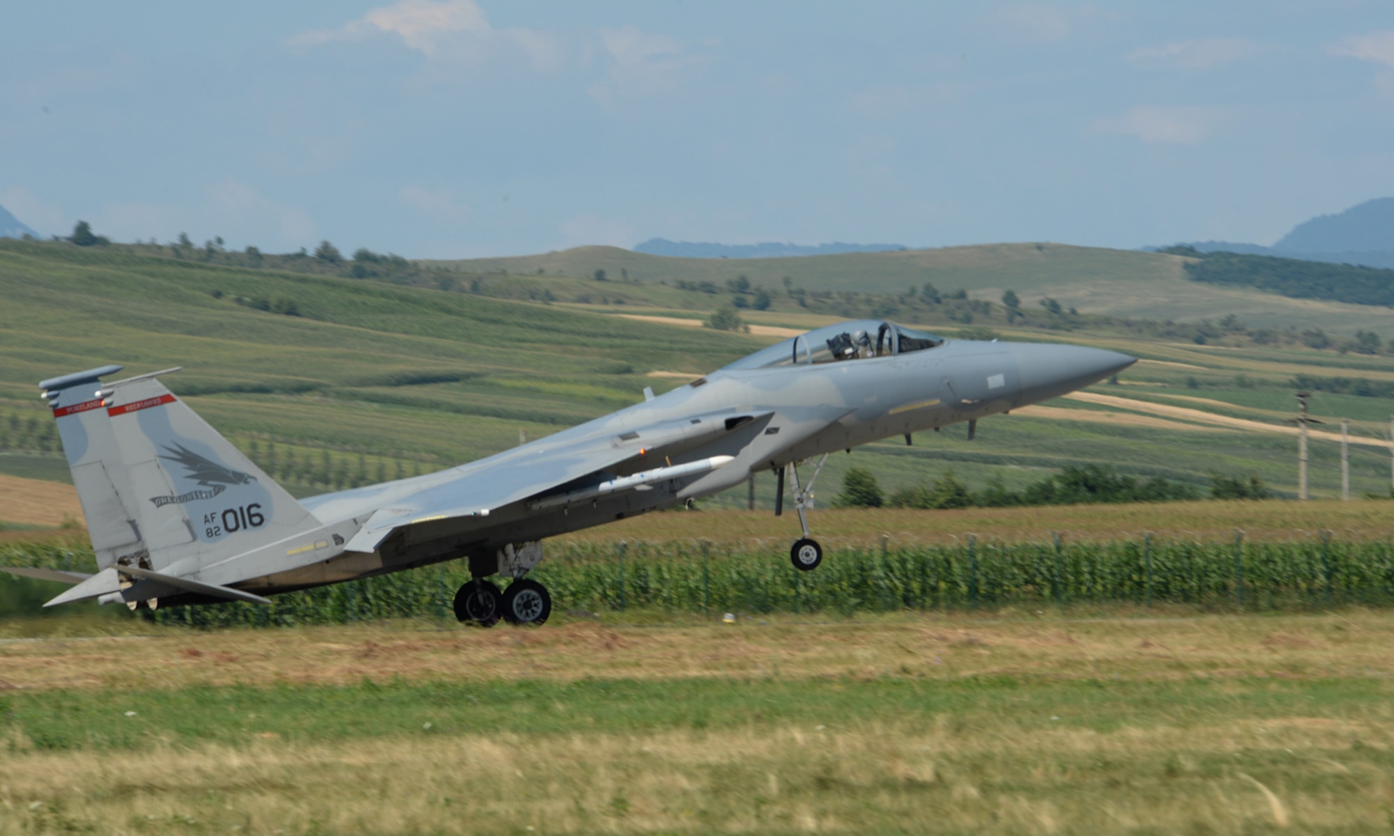 A U.S. Air National Guard F-15C Eagle fighter aircraft pilot assigned to the 123rd Expeditionary Fighter Squadron lands during a theater security package deployment July 21, 2015, at Campia Turzii, Romania. U.S. Air Force fighter squadrons have previously deployed as part of similar theater security packages to the Pacific theater since 2004. (U.S. Air Force photo by Senior Airman Dylan Nuckolls/Released)