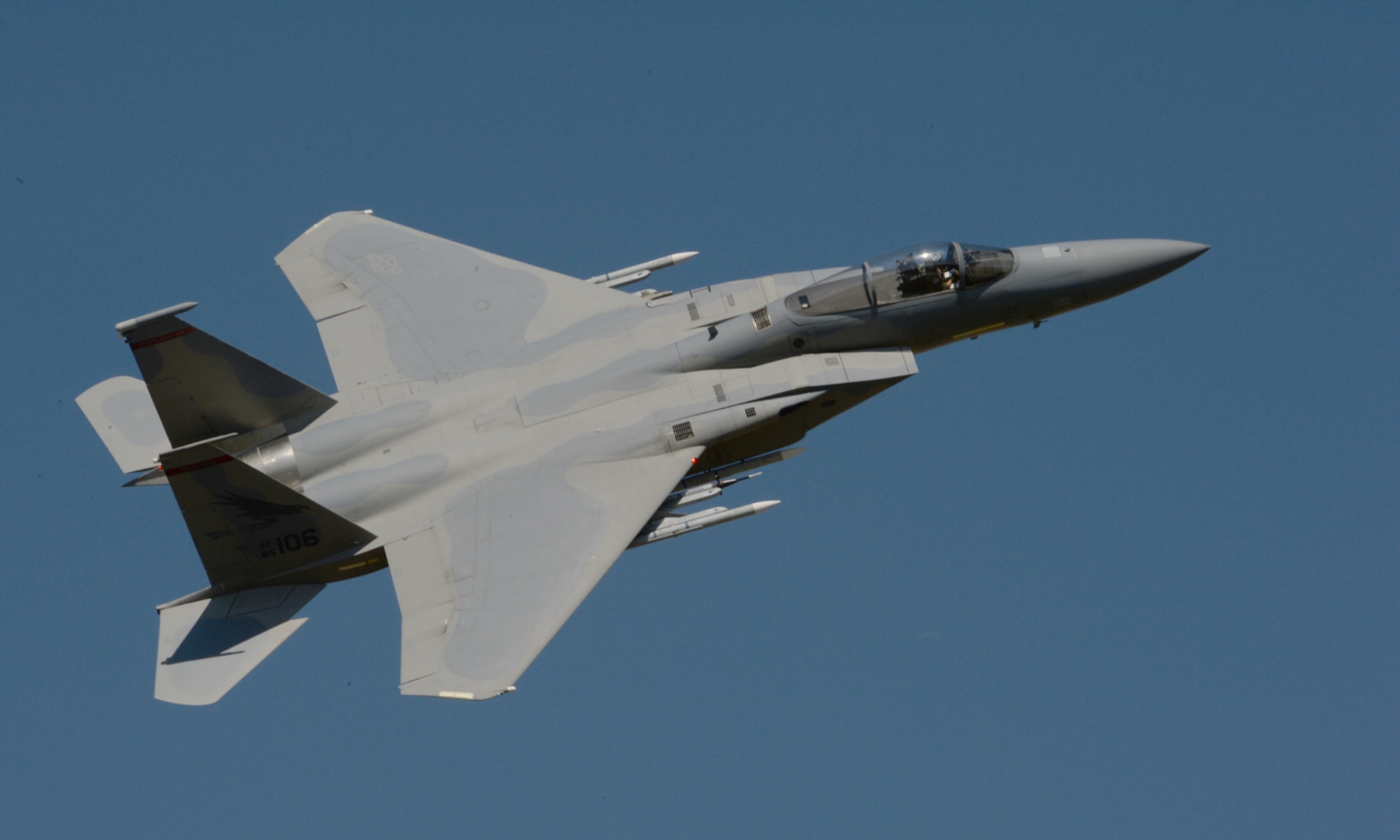 A U.S. Air National Guard F-15C Eagle fighter aircraft assigned to the 123rd Expeditionary Fighter Squadron flies over the flightline during a theater security package deployment July 21, 2015, at Campia Turzii, Romania. The 12 F-15C Eagle fighter aircraft are currently in NATO control. The Transfer of Authority of the F-15C Eagles to NATO allows the 123rd EFS to train with partner allies in a routine manner. (U.S. Air Force photo by Senior Airman Dylan Nuckolls/Released)