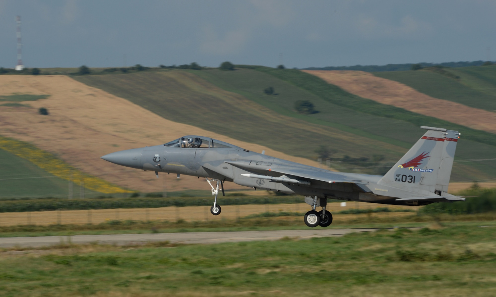 A U.S. Air National Guard F-15C Eagle fighter aircraft pilot assigned to the 123rd Expeditionary Fighter Squadron takes off from the runway July 21, 2015, at Campia Turzii, Romania. The U.S. Air Force’s forward presence in Europe allows cooperation among NATO allies and partners to develop and improve ready air forces capable of maintaining regional security. (U.S. Air Force photo by Senior Airman Dylan Nuckolls/Released)