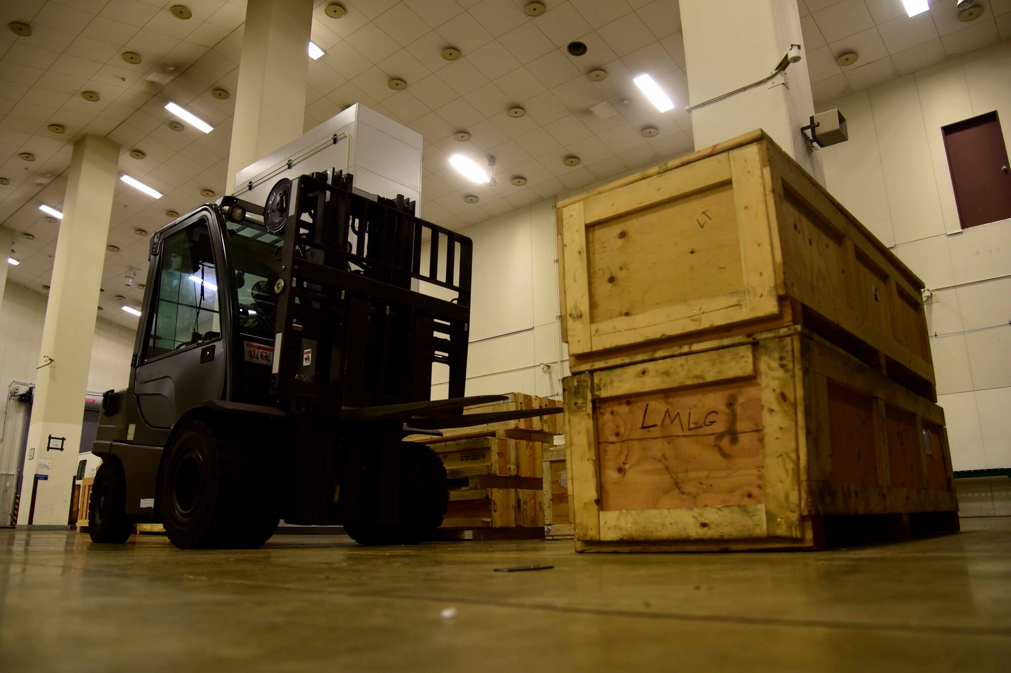 U.S. Air Force Senior Airman Rodrick Jackson, 35th Logistics Readiness Squadron aircraft parts store journeyman, operates a forklift at Misawa Air Base, Japan, July 21, 2015. This forklift is one of two in the store, and can hold up to 5,000 pounds of equipment. (U.S. Air Force photo by Airman 1st Class Jordyn Fetter/Released)