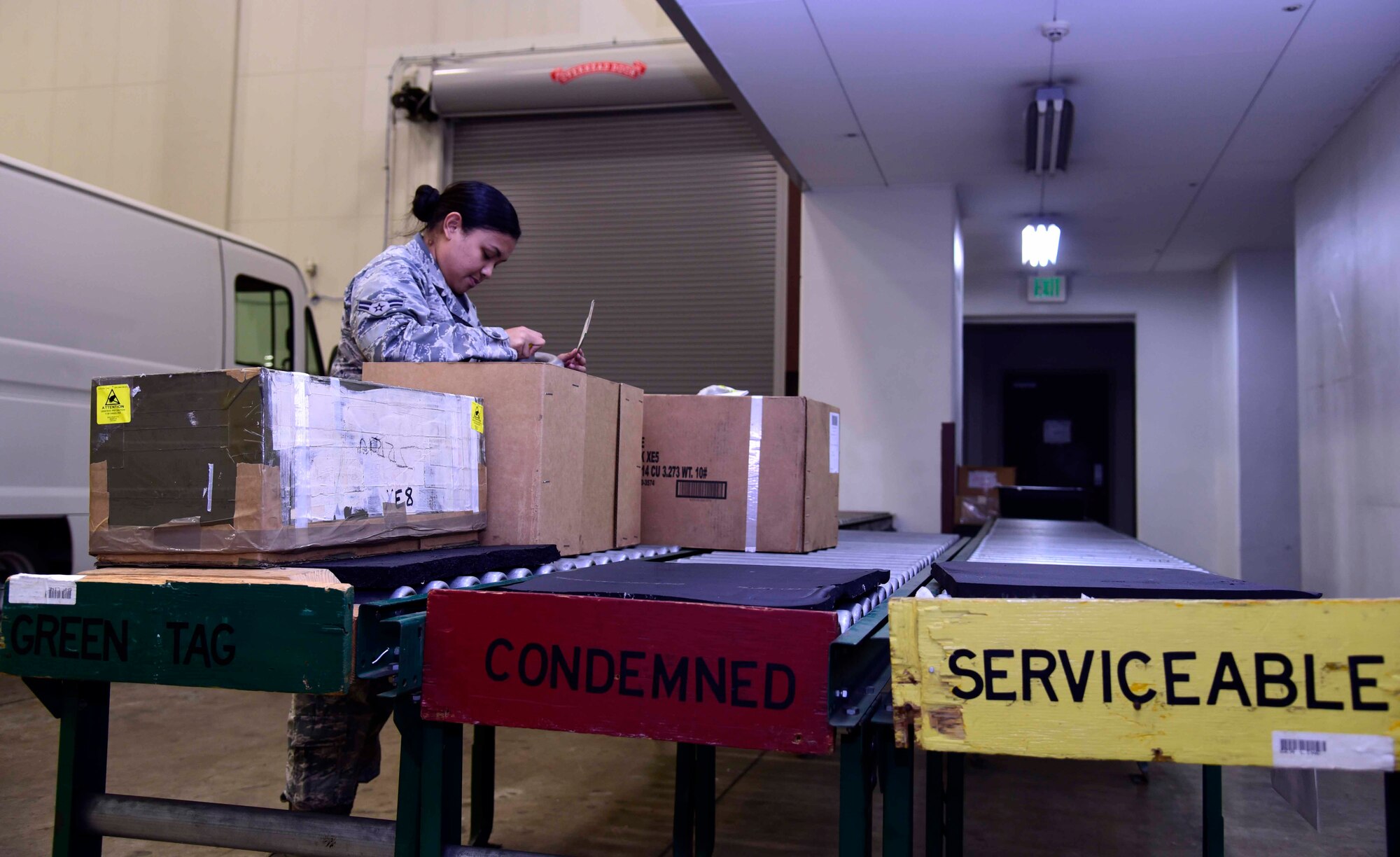 U.S. Air Force Airman 1st Class Esel Sungino, 35th Logistics Readiness Squadron flight service member, inspects incoming aircraft parts at Misawa Air Base, Japan, July 21, 2015. Aircraft parts go through this shipment line and are determined to be in good, condemned, or serviceable condition. (U.S. Air Force photo by Airman 1st Class Jordyn Fetter/Released)