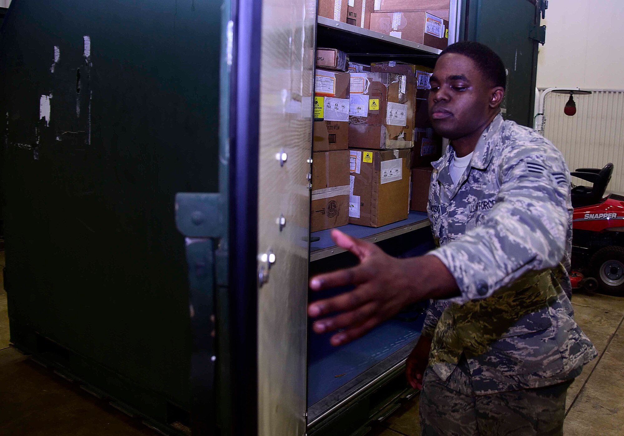 U.S. Air Force Senior Airman Rodrick Jackson, 35th Logistics Readiness Squadron aircraft parts store journeyman, secures a mobility readiness spares package and deployment kits at Misawa Air Base, Japan, July 21, 2015. These MSRPs store aircraft parts and supplies. They travel with Misawa’s F-16 Fighting Falcon’s to ensure the aircraft can be maintained in a deployed or temporary duty location. (U.S. Air Force photo by Airman 1st Class Jordyn Fetter/Released) 