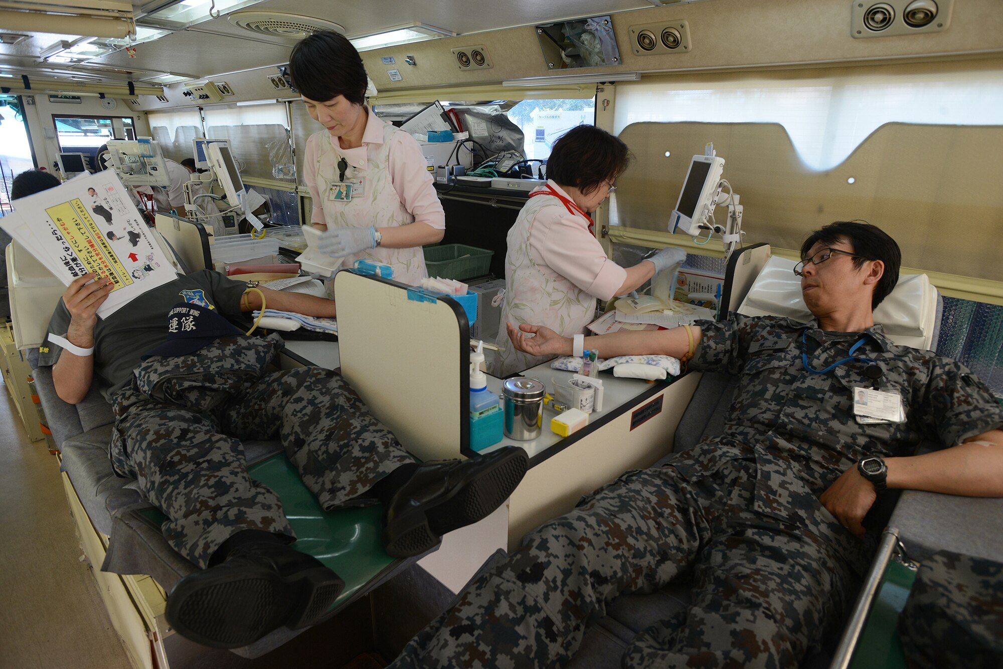Members of the Japan Air Self-Defense Force donate blood to the Japanese Red Cross Society at Yokota Air Base, Japan, July 21, 2015. Blood donations to the JRCS save approximately 1.2 million lives every year. (U.S. Air Force photo by Airman 1st Class David C. Danford/Released)