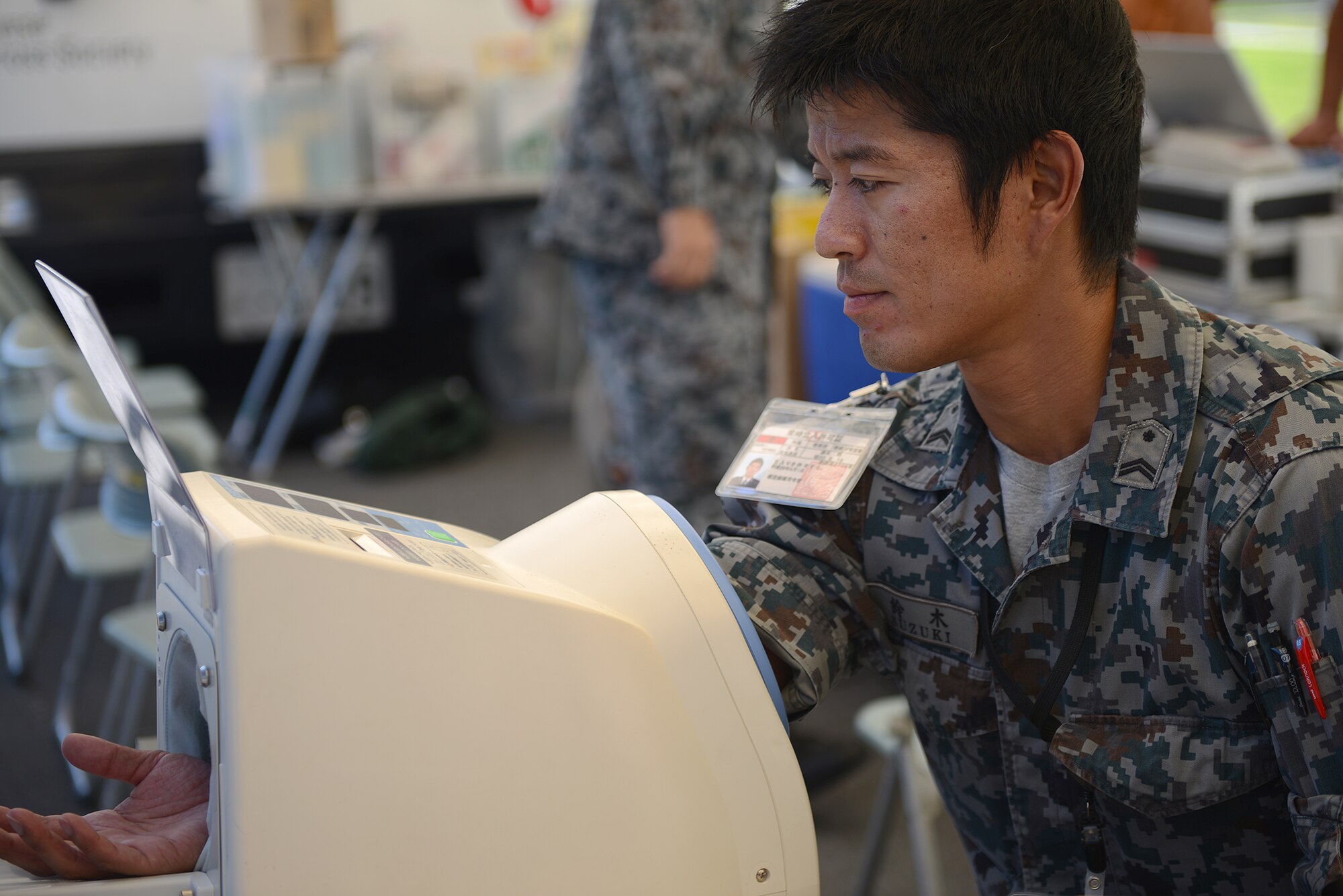 A member of the Japan Air Self-Defense Force has his blood pressure checked before donating blood at Yokota Air Base, Japan, July 21, 2015. The blood drive was a two-day event hosted by the JASDF and Japanese Red Cross Society. (U.S. Air Force photo by Airman 1st Class David C. Danford/Released)