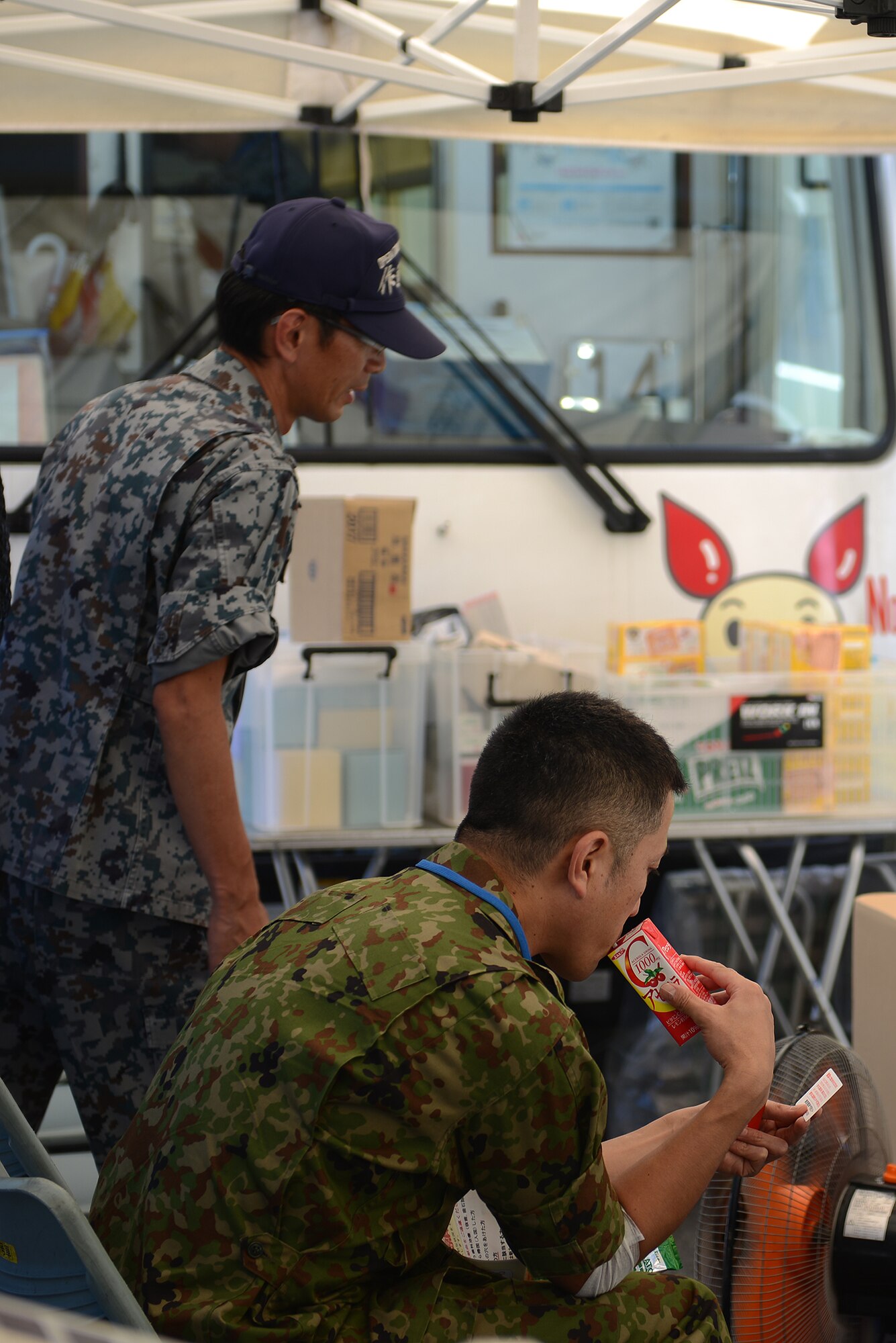 Japan Self-Defense Force personnel recover after donating blood at Yokota Air Base, Japan, July 21, 2015. Donors were encouraged to drink fluids before and after giving blood to ensure their safety. (U.S. Air Force photo by Airman 1st Class David C. Danford/Released)