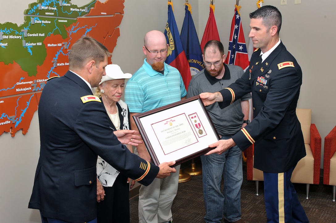 The family of Philip L. Burney, a budget analyst in the Operations Division, was posthumously awarded the Superior Civilian Service Award, a United States flag, flown over the U.S. Capitol, and recognized for forty years of government service during a ceremony at the district June, 9, 2015.  Burney passed away Feb. 1, 2015.  