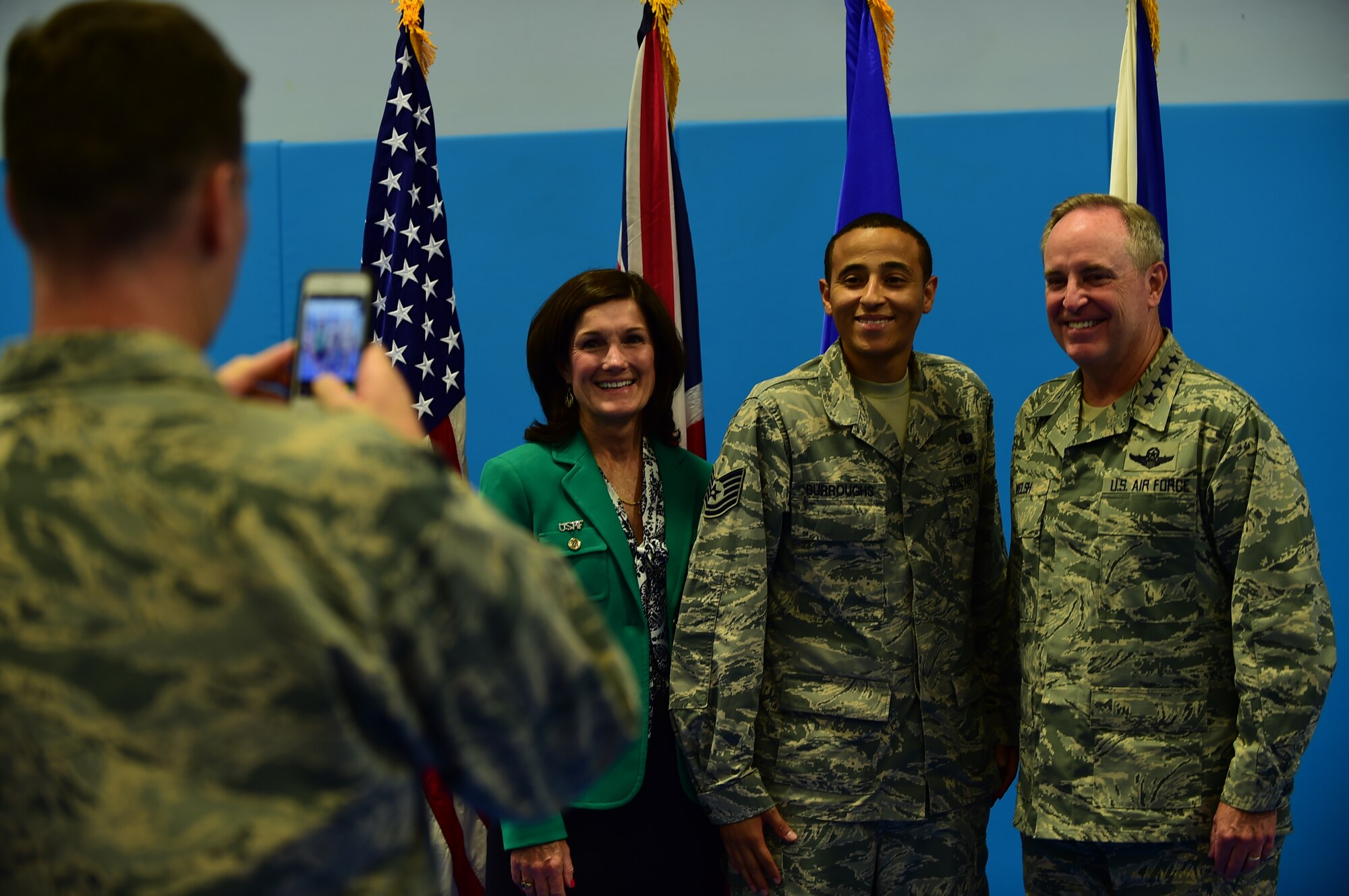 U.S. Air Force Chief of Staff, Gen. Mark A. Welsh III, and his wife, Betty, take a picture with Tech. Sgt. Alfredo Burroughs at RAF Croughton, United Kingdom, July 16, 2015. During Welsh’s visit, he and his wife, Betty, spoke about the importance of reaching out and taking care of Air Force members and their families. (U.S. Air Force photo by Tech. Sgt. Chrissy Best/Released)