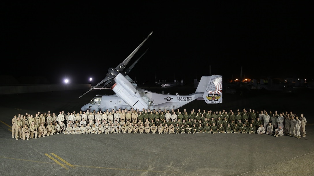 U.S. Marines of Marine Medium Tiltrotor Squadron 165, Special Purpose Marine Air-Ground Task Force-Crisis Response-Central Command, pose for a photo with a ceremonially decorated MV-22 Osprey, in Southwest Asia, July 17, 2015. The Marines of VMM – 165 celebrate the unit’s 50th anniversary while deployed with the SPMAGTF; providing long range assault support, troop transport and cargo delivery in the Central Command Area of Operations, as well as support to the Tactical Recovery of Aircraft and Personnel.