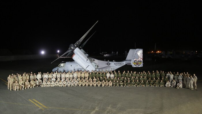 U.S. Marines of Marine Medium Tiltrotor Squadron 165, Special Purpose Marine Air-Ground Task Force-Crisis Response-Central Command, pose for a photo with a ceremonially decorated MV-22 Osprey, in Southwest Asia, July 17, 2015. The Marines of VMM – 165 celebrate the unit’s 50th anniversary while deployed with the SPMAGTF; providing long range assault support, troop transport and cargo delivery in the Central Command Area of Operations, as well as support to the Tactical Recovery of Aircraft and Personnel.