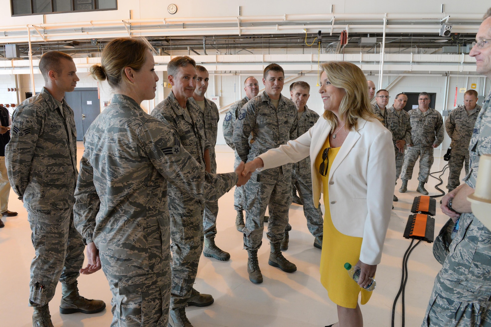 Secretary of the Air Force Deborah Lee James shakes the hand of Senior Airman Devon Brekke, a member of the 119th Wing, July 21, 2015, at the North Dakota Air National Guard base in Fargo. James’ visit to the 119th Wing included meetings with Guard leaders and elected and civic officials, followed by an all-staff meeting that was attended by North Dakota Air National Guard members.