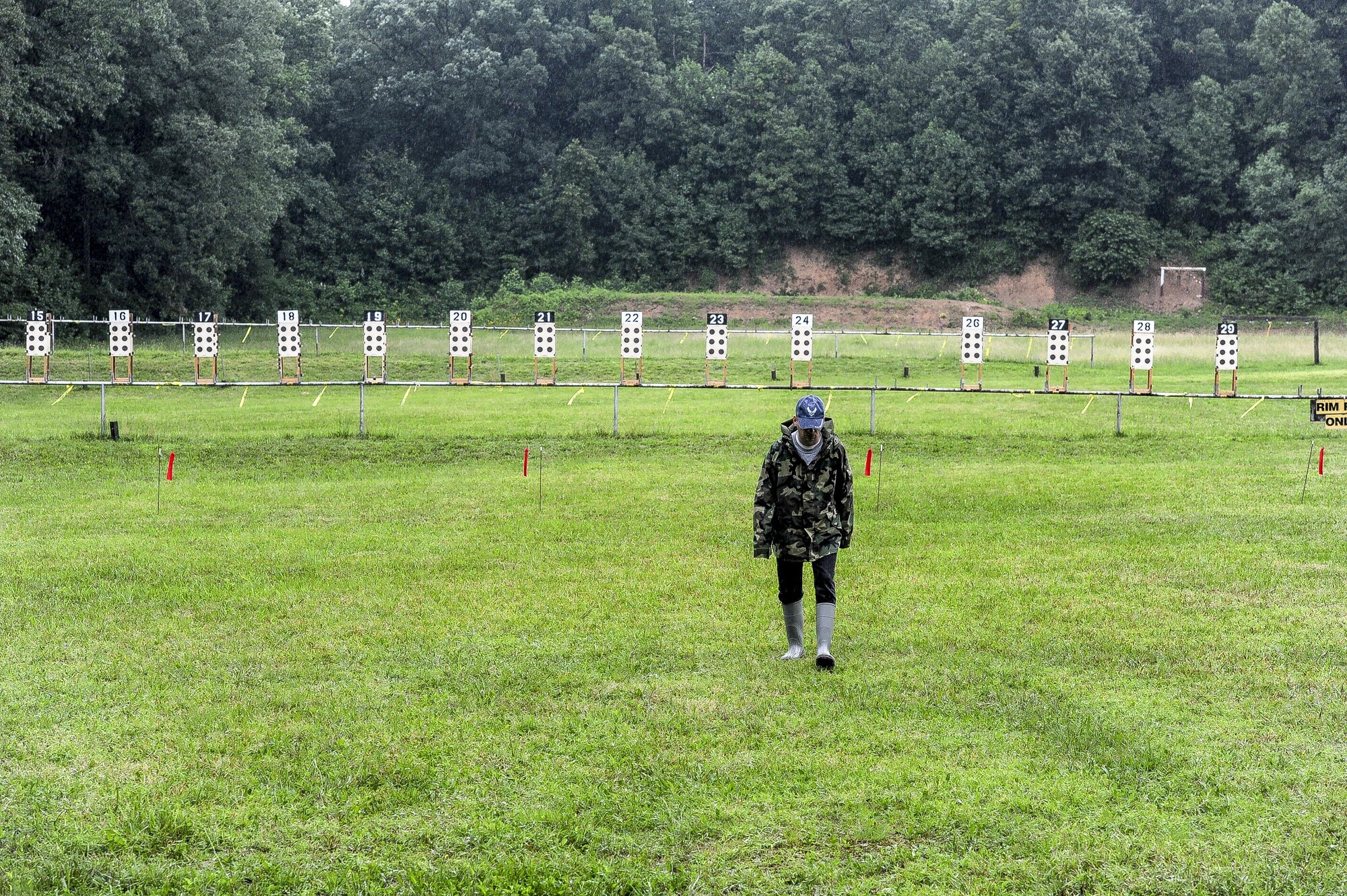 Lt. Col. Mark Gould makes his way back to the shooting platform after placing his target downrange during the Dave Cramer Memorial Smallbore Regional Prone Metric NRA Regional Tournament in New Freedom, Pa., June 27, 2015. Gould, a foreign liaison officer for the Defense Intelligence Agency’s Office of Partner Engagement at the Pentagon, finished second in his class and fourth overall at the tournament. Gould has been involved in competitive shooting for the past 23 years and has been a member of the Air Force International Rifle Team for 17 years. (U.S. Air Force photo/Staff Sgt. Christopher Gross)