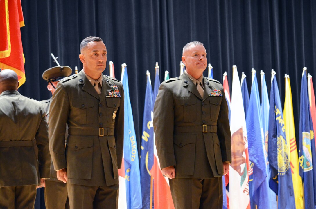 Col. Joseph Murray, left, assumes command of Marine Corps Base Quantico from Col. David Maxwell in a ceremony held at Little Hall on Friday morning.