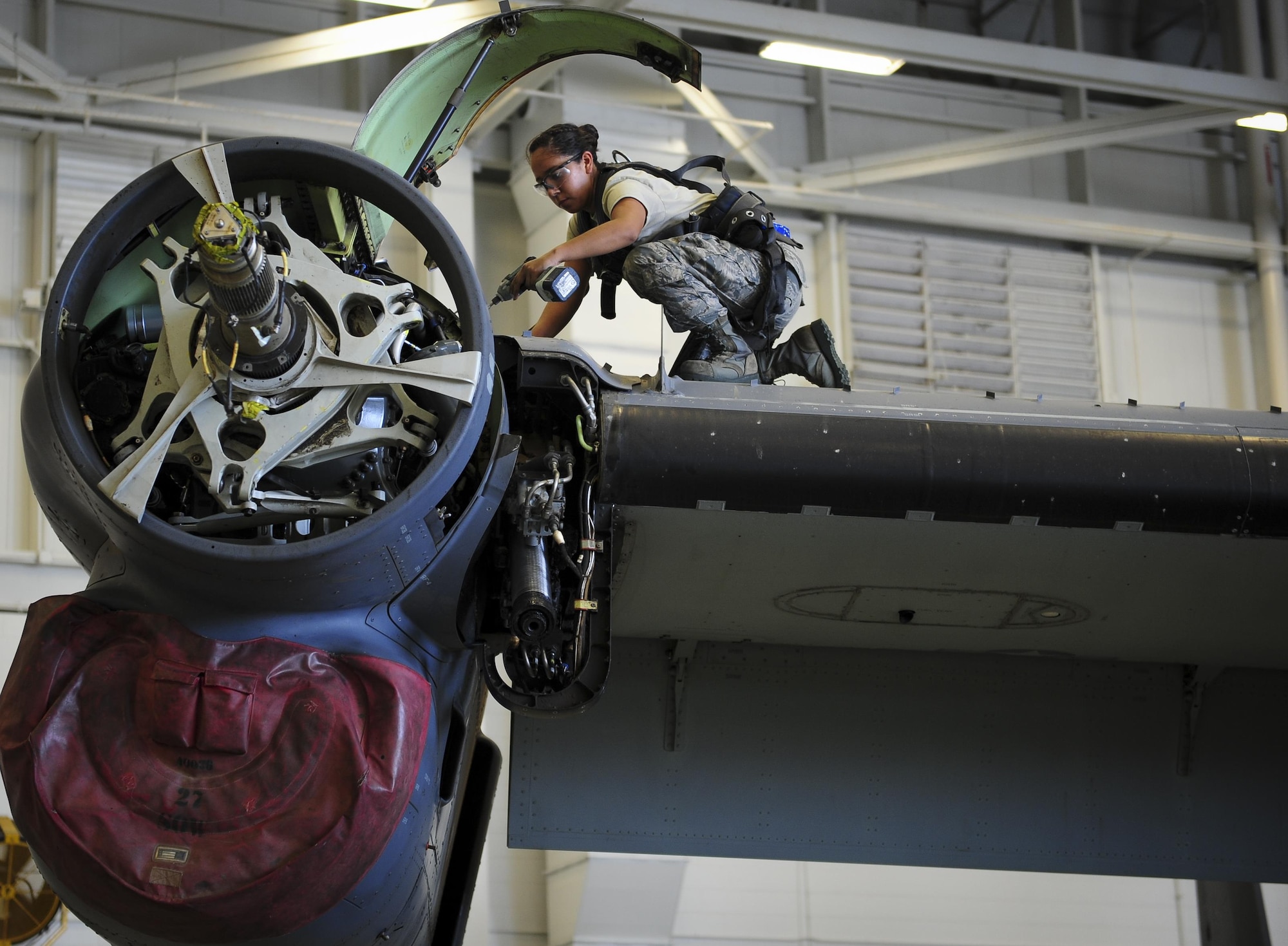 Senior Airman Mayra Tiebout, 801st Special Operations Aircraft Maintenance Squadron electrical and environmental technician, replaces gas generators on a CV-22B Osprey at Hurlburt Field Fla., July 20, 2015. The 801st SOAMXS’s mission is to perform all equipment maintenance in support of worldwide special operations missions in response to national command authority taskings for the CV-22B Osprey and the MC-130H Talon II. Maintenance includes aircraft servicing, phase inspections, troubleshooting, repair, modifications and launch recovery for all aircraft. (U.S. Air Force photo/Senior Airman Meagan Schutter)