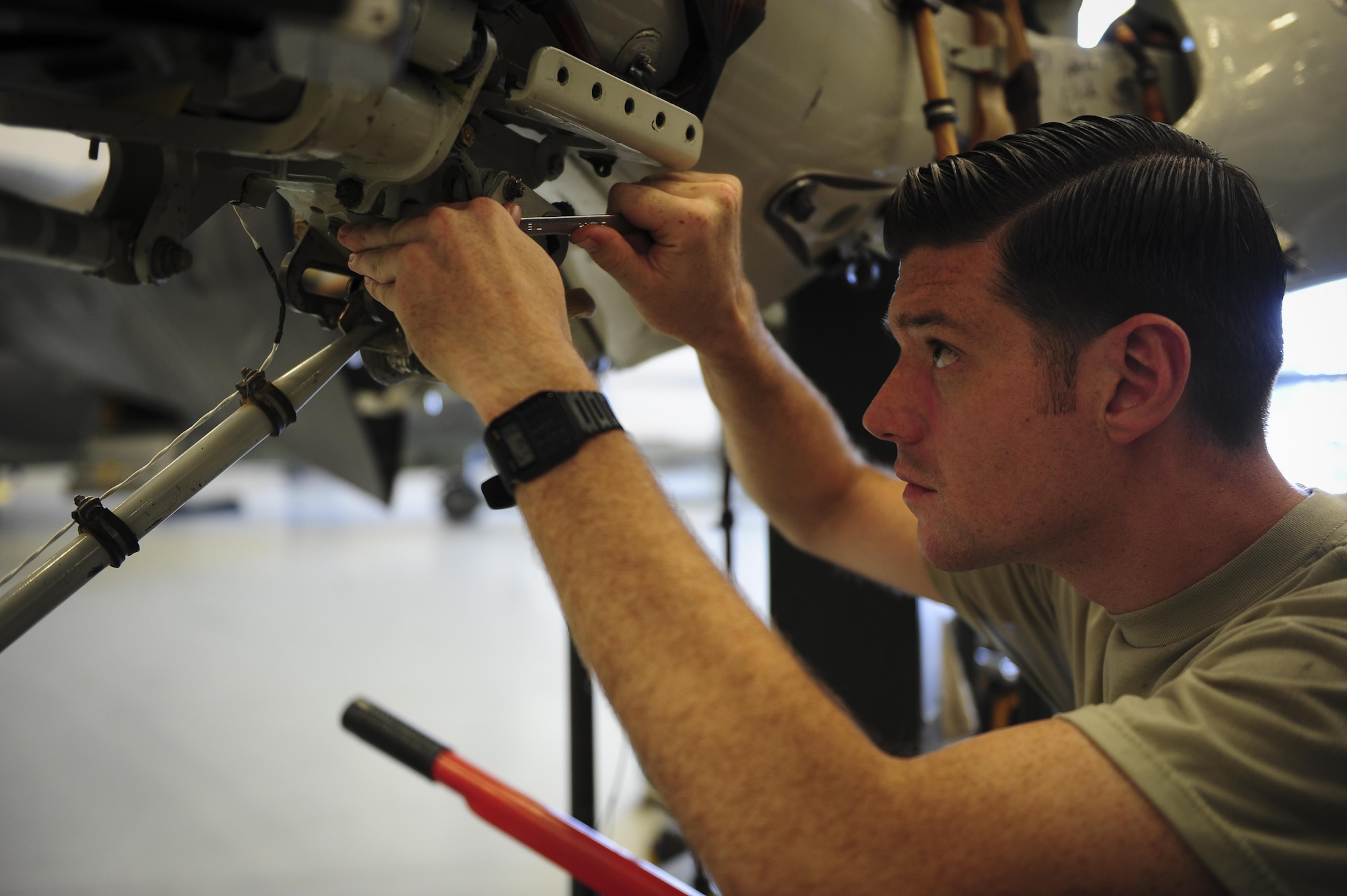 Staff Sgt. Michael Dolph, 801st Special Operations Aircraft Maintenance Squadron crew chief, tightens a bolt to a CV-22B Osprey blade fold assembly at Hurlburt Field Fla., July 20, 2015. The 801st SOAMXS’s mission is to perform all equipment maintenance in support of worldwide special operations missions in response to national command authority taskings for the CV-22B Osprey and the MC-130H Talon II. Maintenance includes aircraft servicing, phase inspections, troubleshooting, repair, modifications and launch recovery for all aircraft. (U.S. Air Force photo/Senior Airman Meagan Schutter)