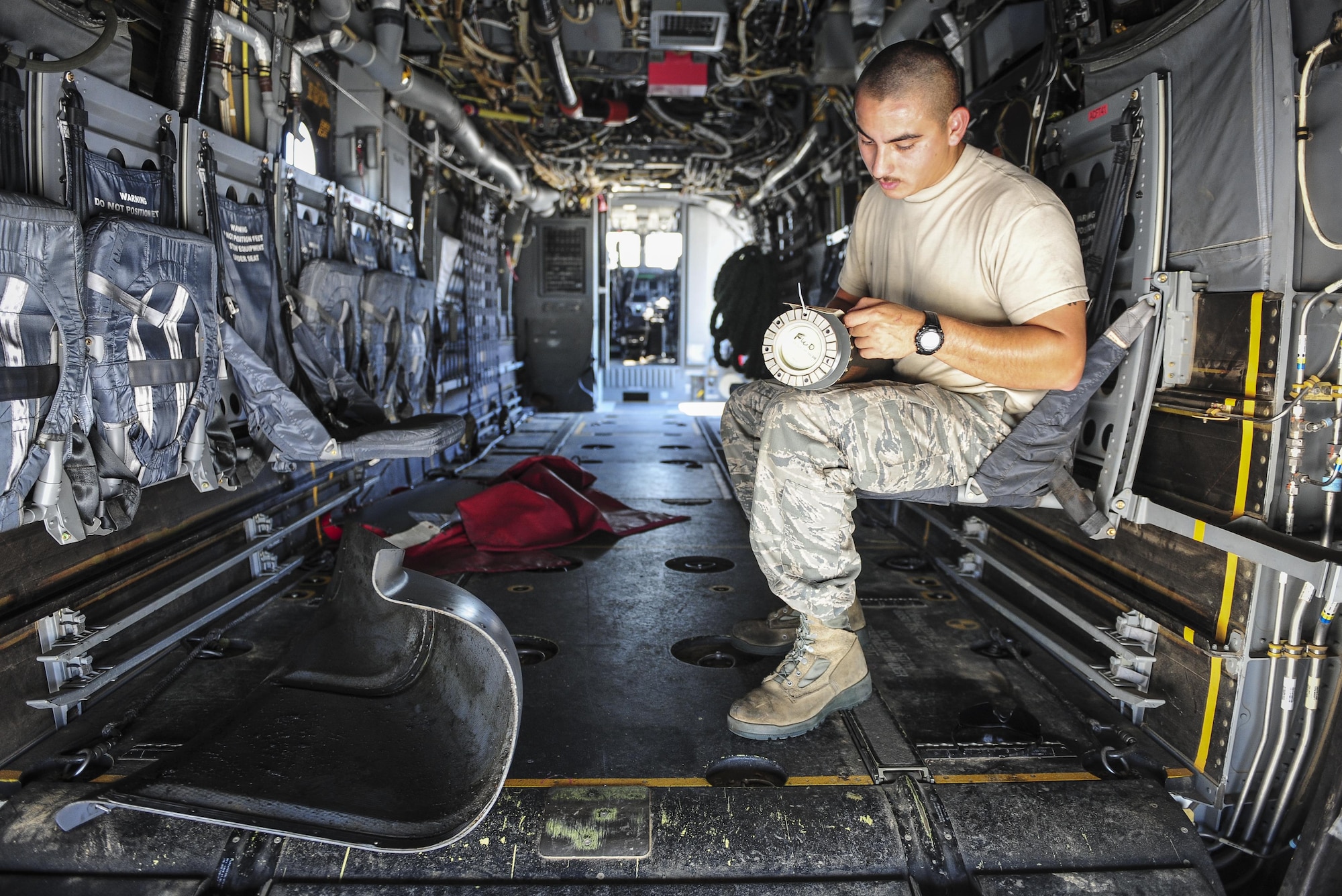 Staff Sgt. Johnny Rivas, 801st Special Operations Aircraft Maintenance Squadron crew chief, labels a CV-22B Osprey drive shaft on the flight line at Hurlburt Field Fla., July 20, 2015. The 801st SOAMXS’s mission is to perform all equipment maintenance in support of worldwide special operations missions in response to national command authority taskings for the CV-22B Osprey and the MC-130H Talon II. Maintenance includes aircraft servicing, phase inspections, troubleshooting, repair, modifications and launch recovery for all aircraft. (U.S. Air Force photo/Senior Airman Meagan Schutter)