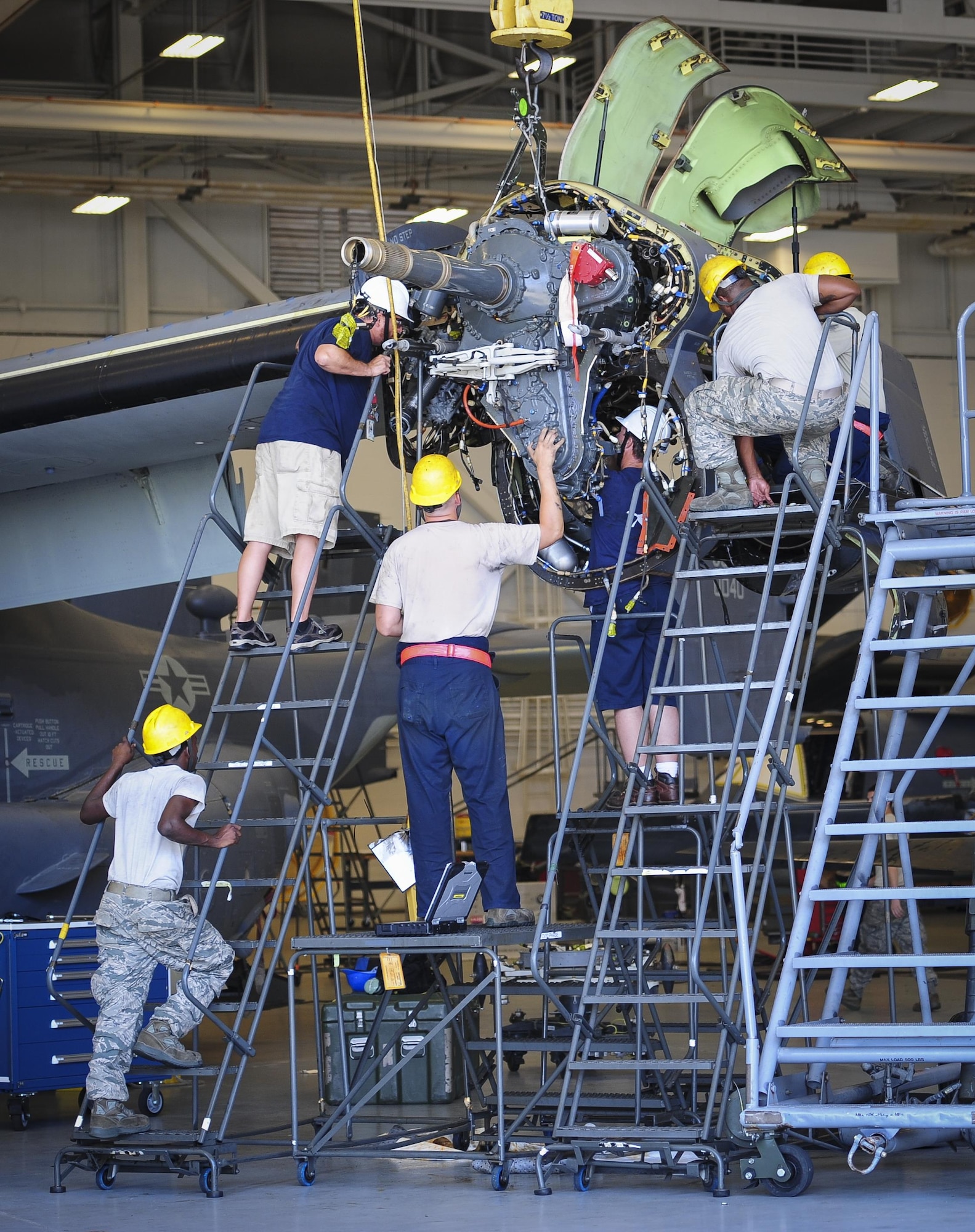 Airmen with the 801st Special Operations Aircraft Maintenance Squadron, perform maintenance on a CV-22B Osprey gear box at Hurlburt Field Fla., July 20, 2015. The 801st SOAMXS’s mission is to perform all equipment maintenance in support of worldwide special operations missions in response to national command authority taskings for the CV-22B Osprey and the MC-130H Talon II. Maintenance includes aircraft servicing, phase inspections, troubleshooting, repair, modifications and launch recovery for all aircraft. (U.S. Air Force photo/Senior Airman Meagan Schutter)