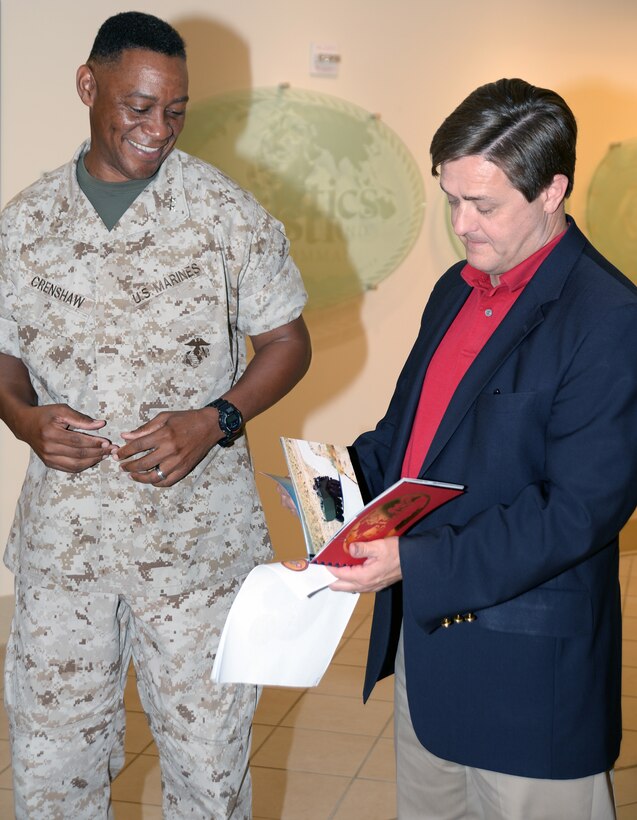 Georgia’s ninth Commissioner of Labor, Mark Butler, talks with Maj. Gen. Craig Crenshaw, commanding general, Marine Corps Logistics Command, July 22, during an afternoon consisting of briefs, tours and fellowship.