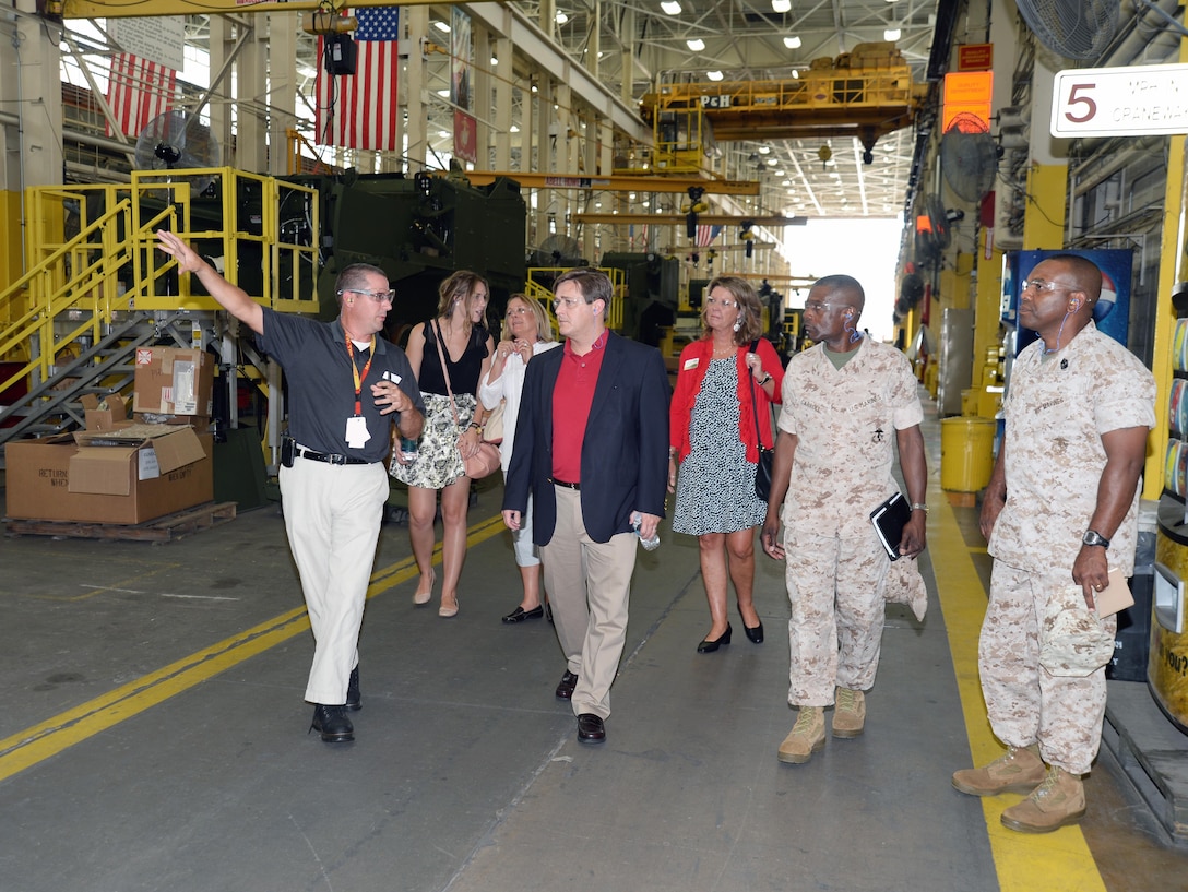 Georgia’s ninth Commissioner of Labor, Mark Butler, (center) and his staff joined officials here at Marine Corps Logistics Base Albany and Marine Corps Logistics Command, July 22, for an afternoon consisting of briefs, tours and fellowship.