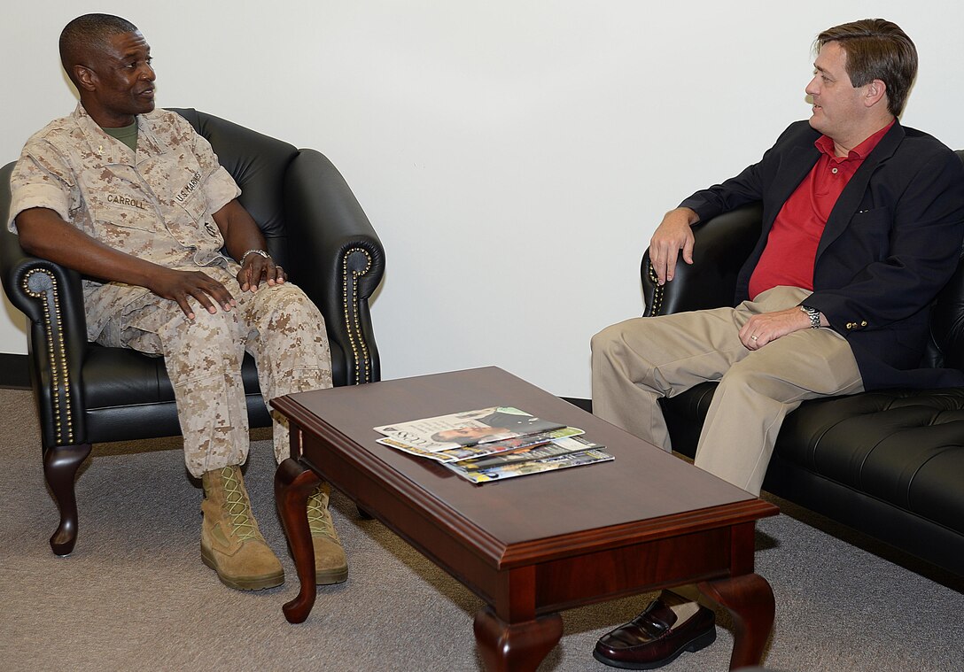 Georgia’s ninth Commissioner of Labor, Mark Butler, visits with Col. James Carroll III, commanding officer, Marine Corps Logistics Base Albany, July 22, during an afternoon consisting of briefs, tours and fellowship.