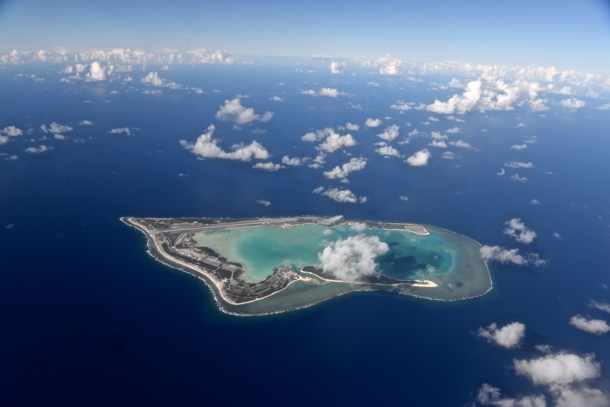 Wake Island, pictured as viewed from the north, was completely evacuated July 15, 2015, in preparation for Typhoon Halola closing in on the small atoll. A team with the 36th Contingency Response Group deployed from Andersen Air Force Base, Guam, to the atoll July 20, 2015, to assist permanently assigned airfield staff in storm recovery efforts. (U.S. Air Force photo by Senior Airman Alexander W. Riedel/Released)
