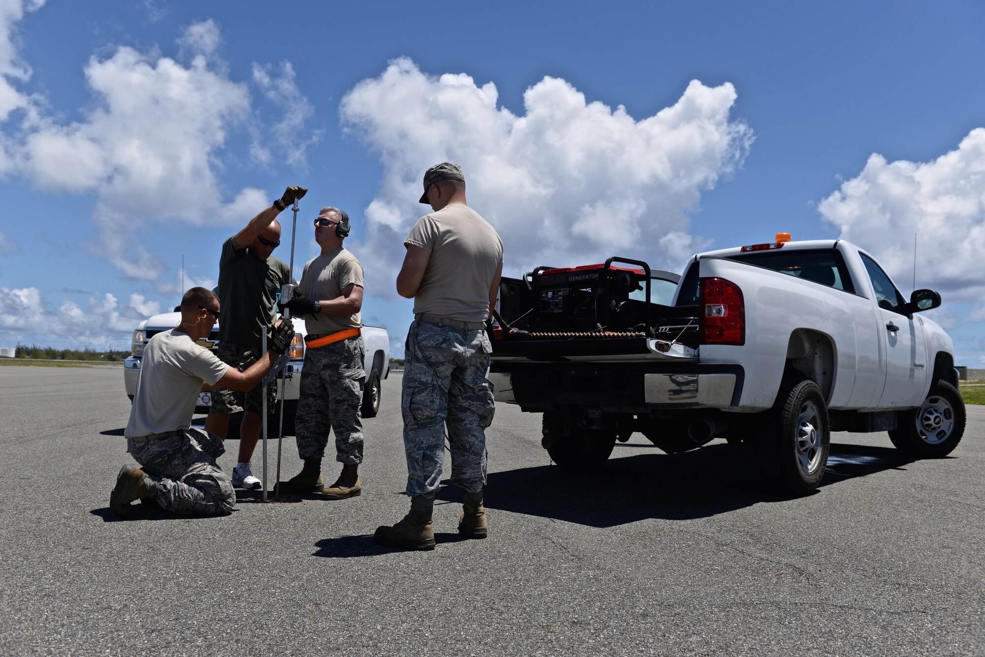 A U.S. Air Force civil engineer team with the 36th Contingency Response Group from Andersen Air Force Base, Guam, tests subsurface reliability of Wake Island Airfield, July 20, 2015, on Wake Island. The Airmen assisted in storm recovery efforts after the island was evacuated a few days earlier in preparation forTyphoon Halola. (U.S. Air Force photo by Senior Airman Alexander W. Riedel/Released)
